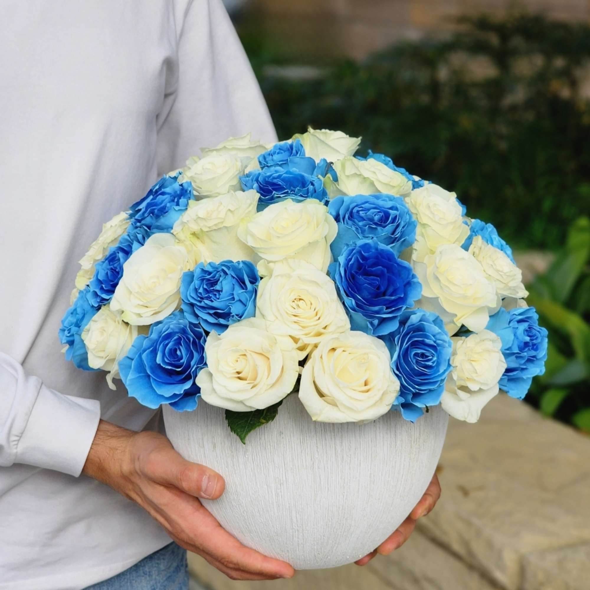 Introducing our exquisite white ceramic vase adorned with stunning blue and white