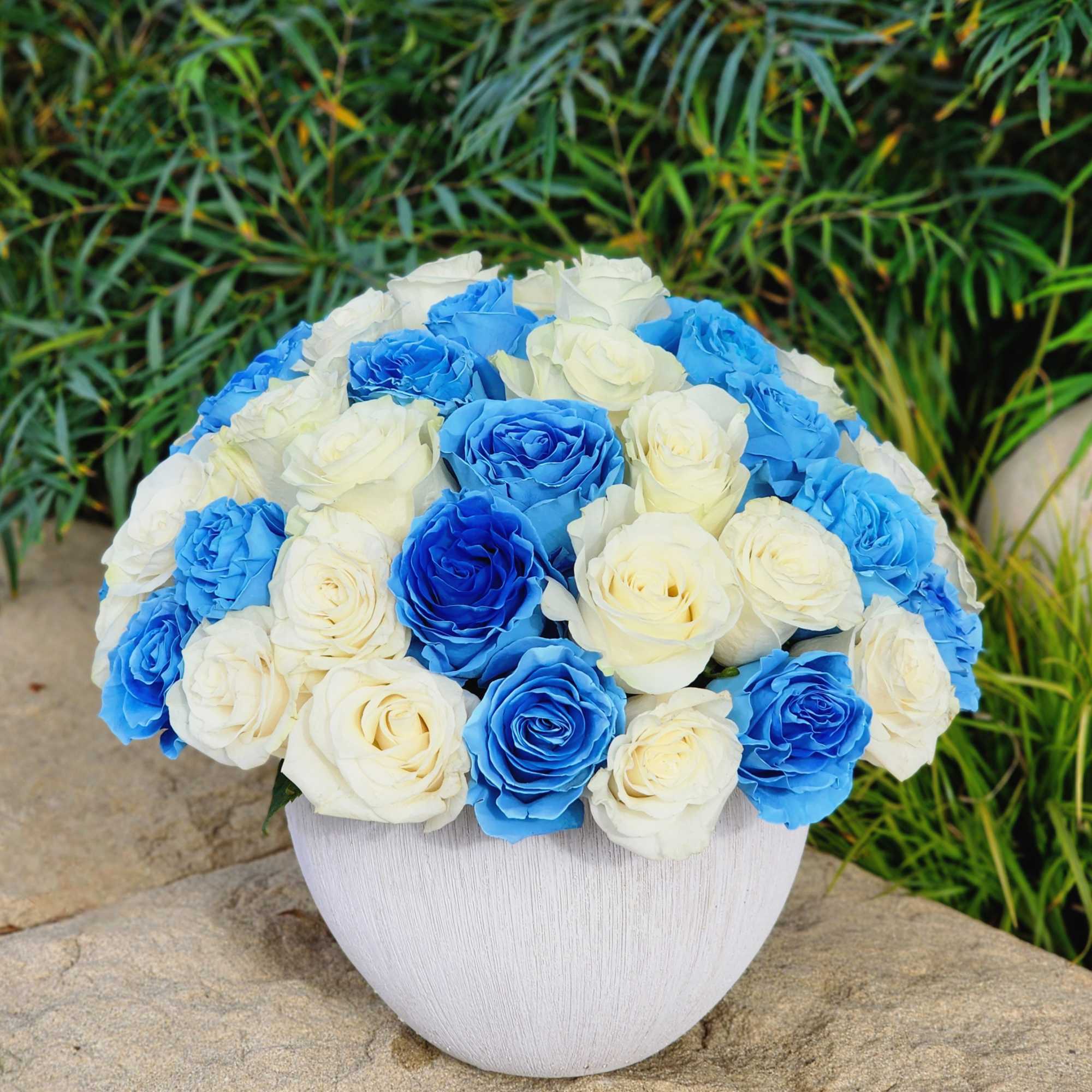 Introducing our exquisite white ceramic vase adorned with stunning blue and white