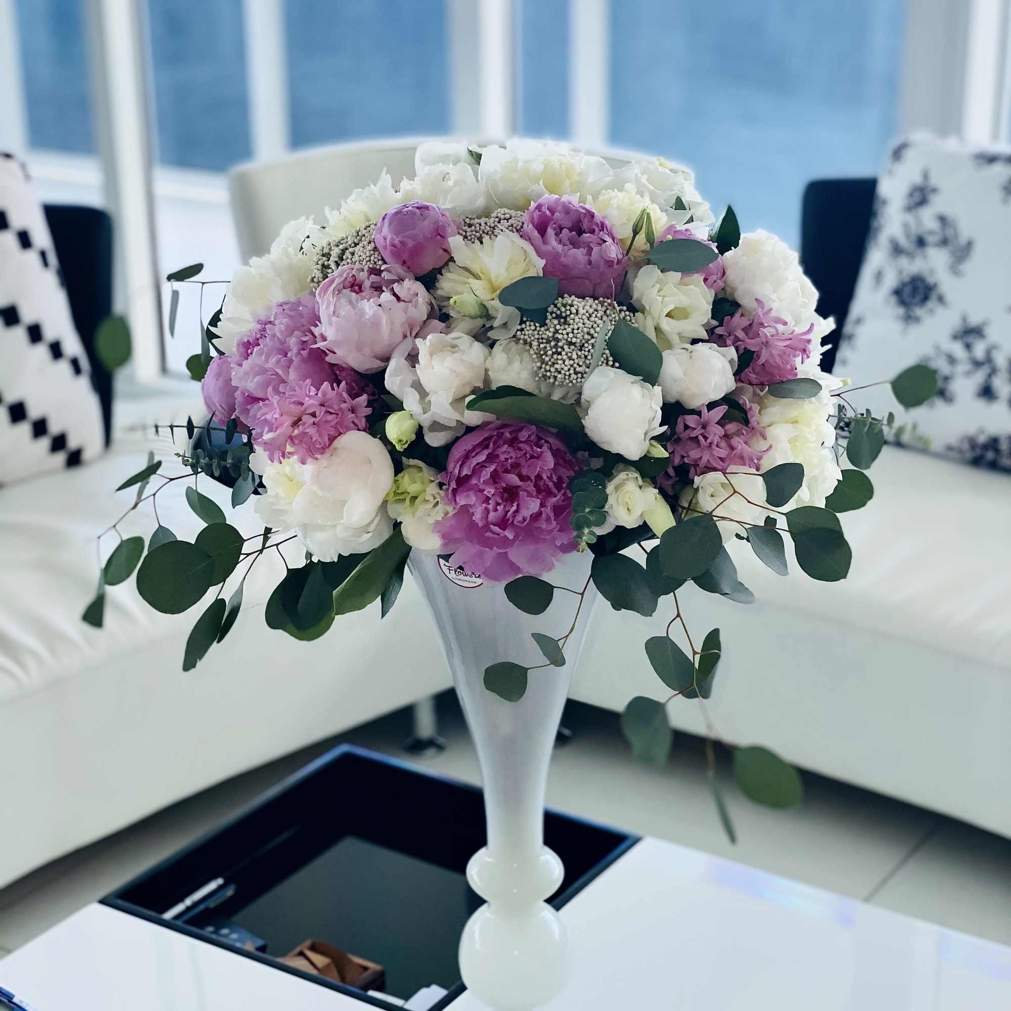 Peonies with lisianthus in a vase . Peony is a symbol of Peonies with lisianthus in a vase . Peony is a symbol of