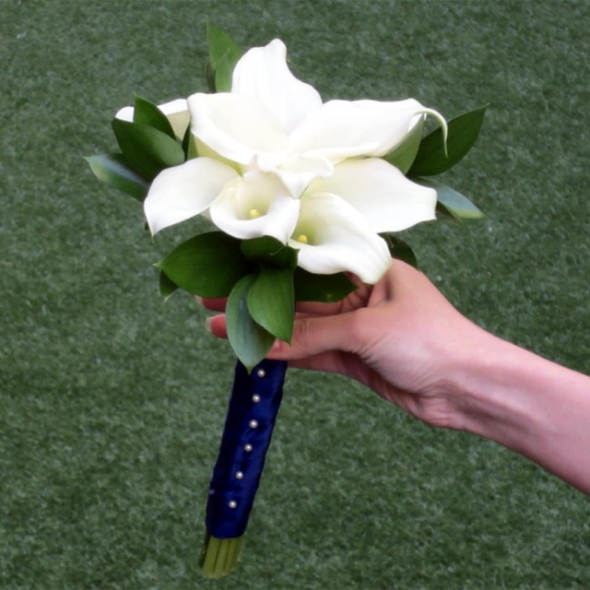 Bridal bouquet of premium Ecuadorian Roses, Mini Calla Lilies and Delphinium. All