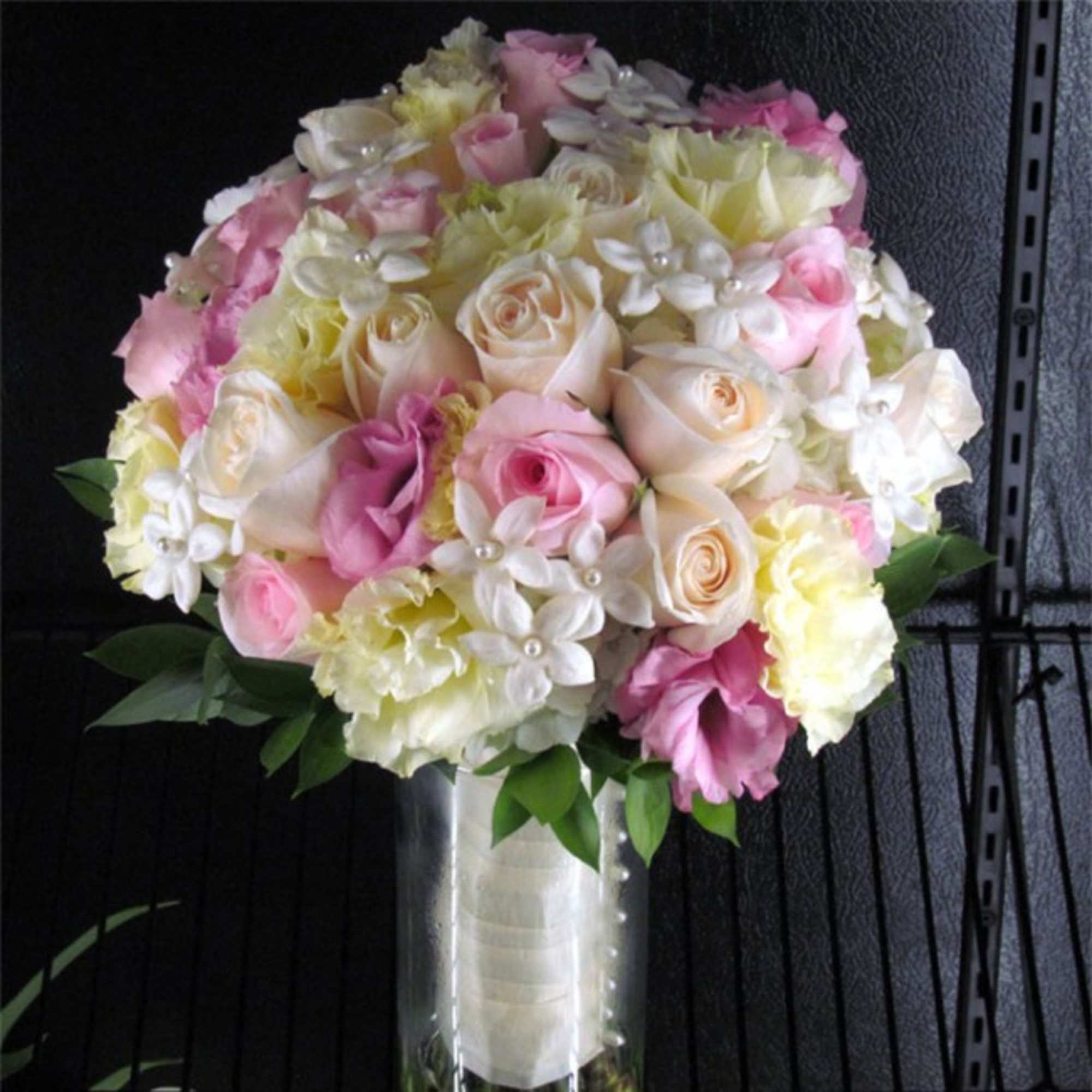 A lovely bridal bouquet of luxury Ecuadorian Roses, Lisianthus and Stephanotis. Order