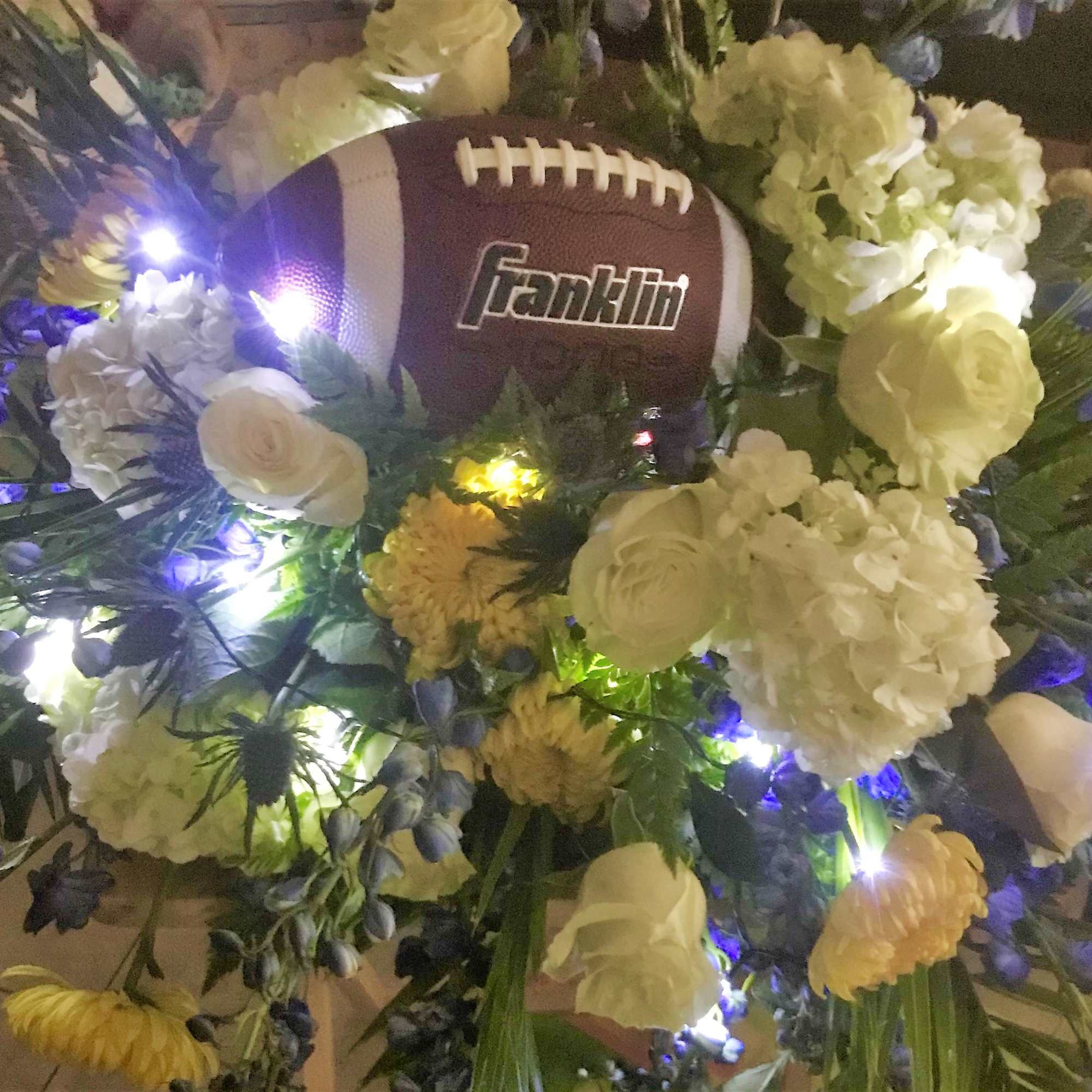 For the football fan, this casket piece is created around the much