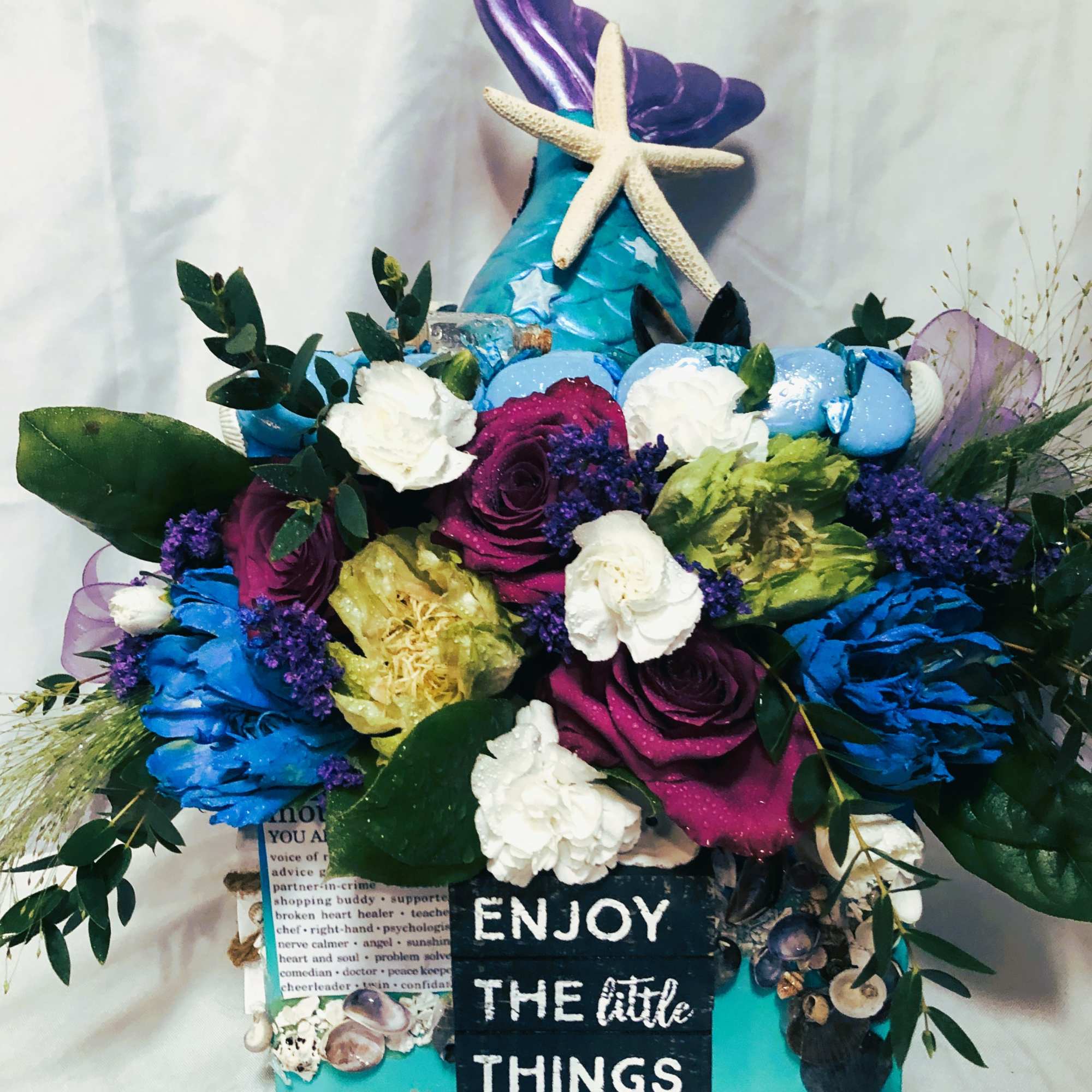 This bloom box is adorned with real seashells, wonderful mom sayings, a