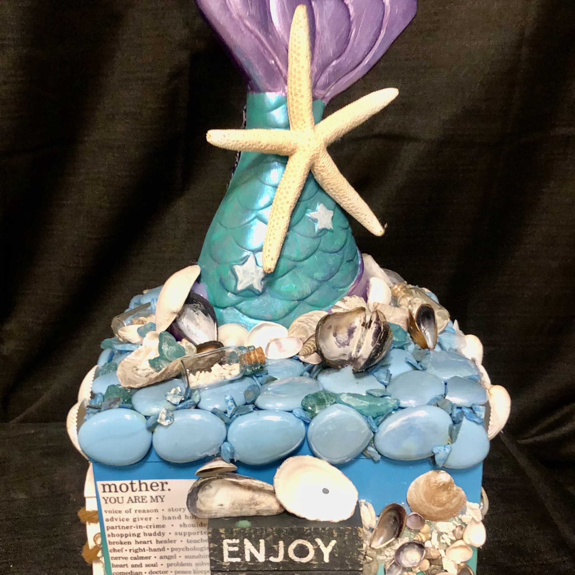 This bloom box is adorned with real seashells, wonderful mom sayings, a