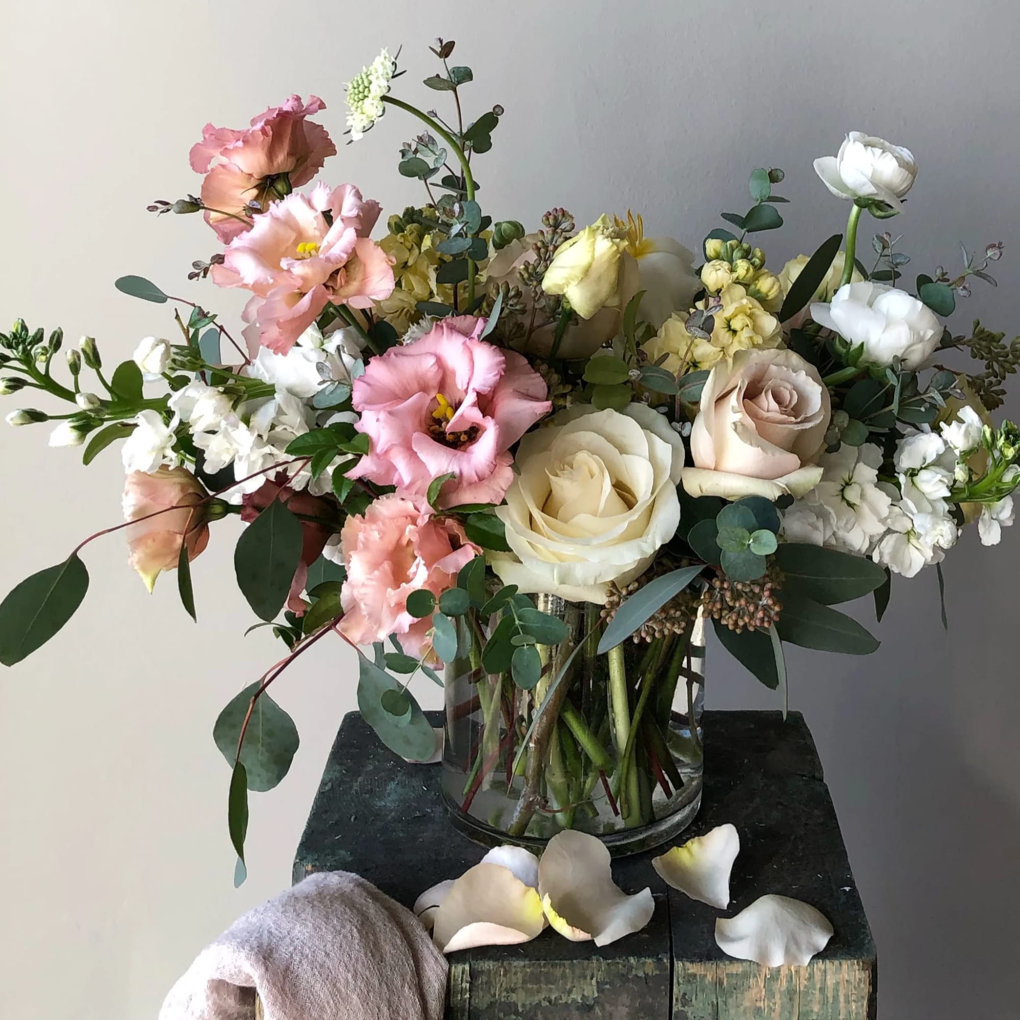 Receive fresh flowers arranged in a glass vase each week for six