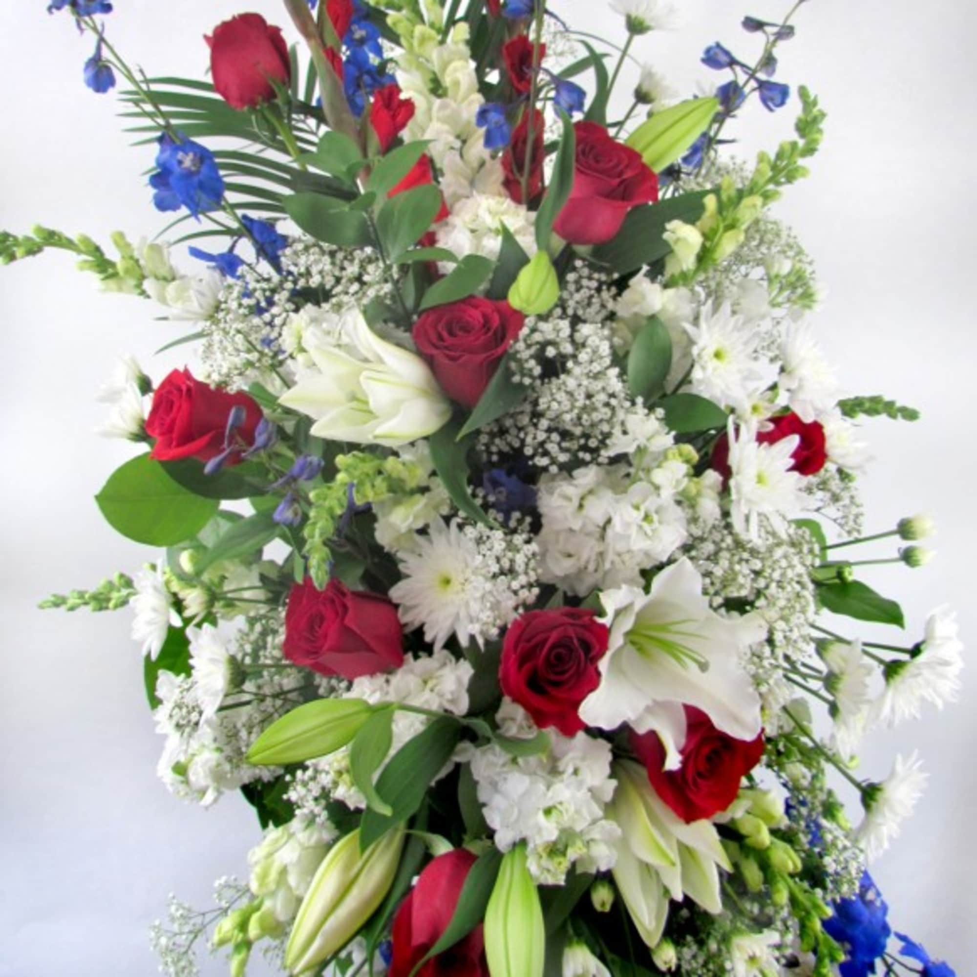 A beautiful and meaningful symbol of love and remembrance, this patriotic spray