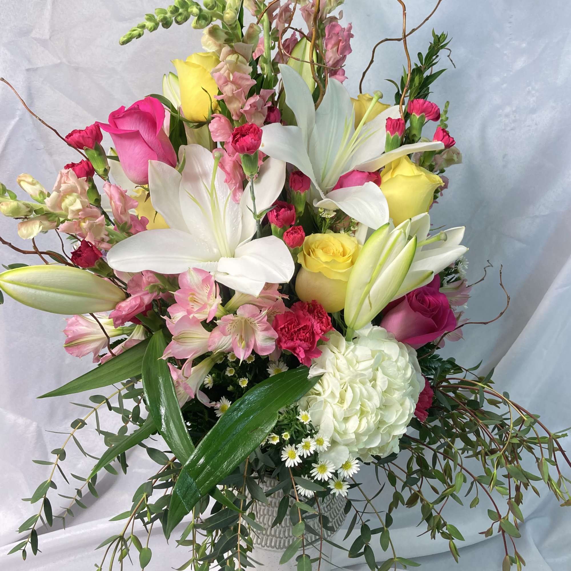 A large display of a whole garden of blooms! This fresh bouquet