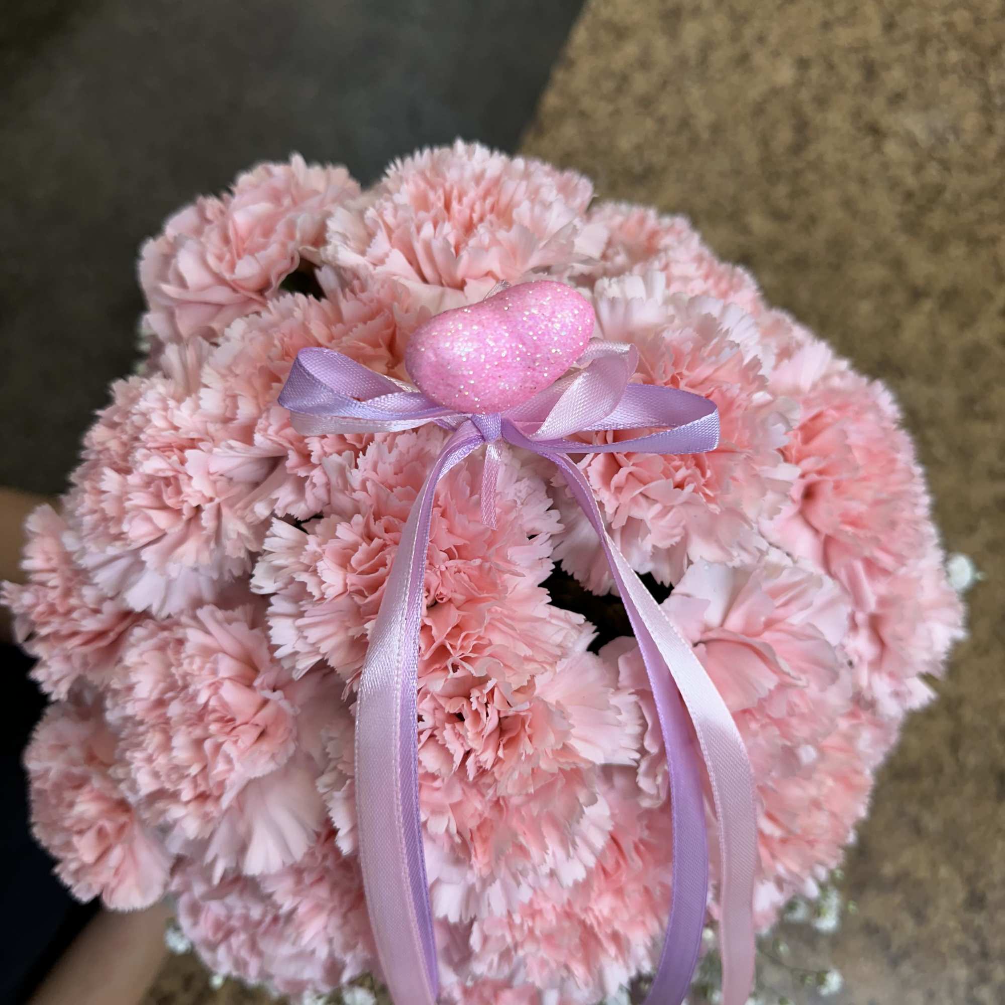 Floral box arrangement fully loaded with pink carnations. 