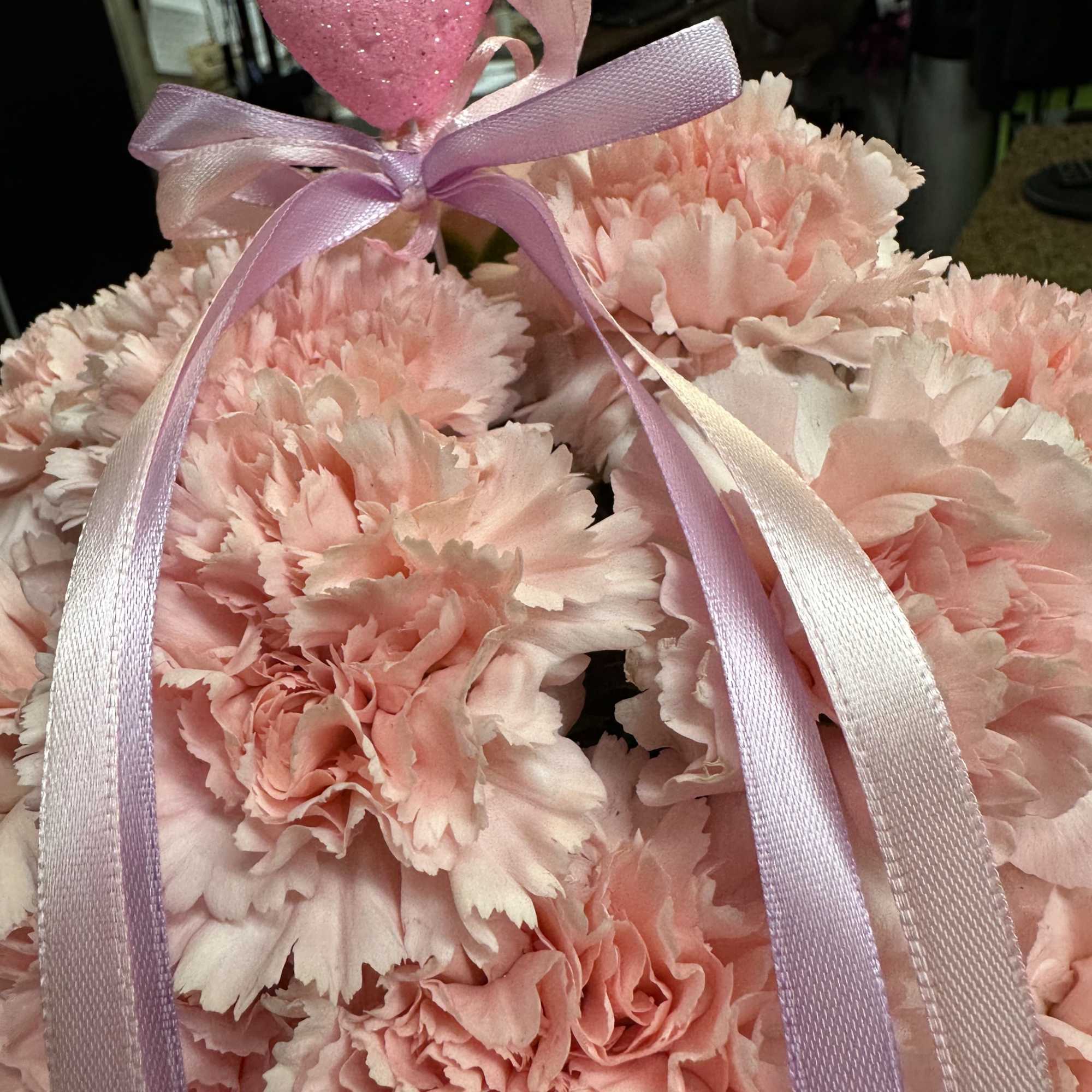 Floral box arrangement fully loaded with pink carnations. 