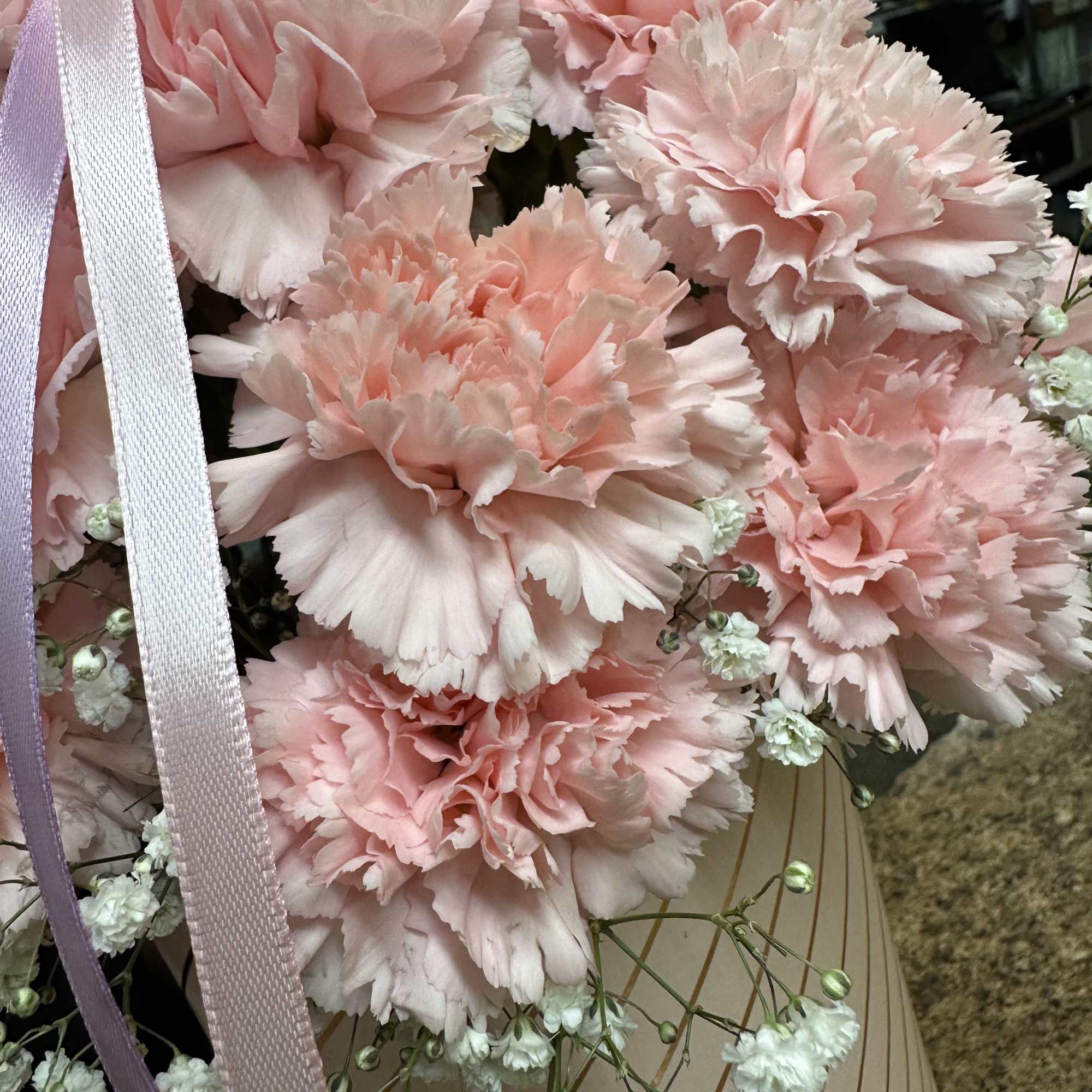 Floral box arrangement fully loaded with pink carnations. 
