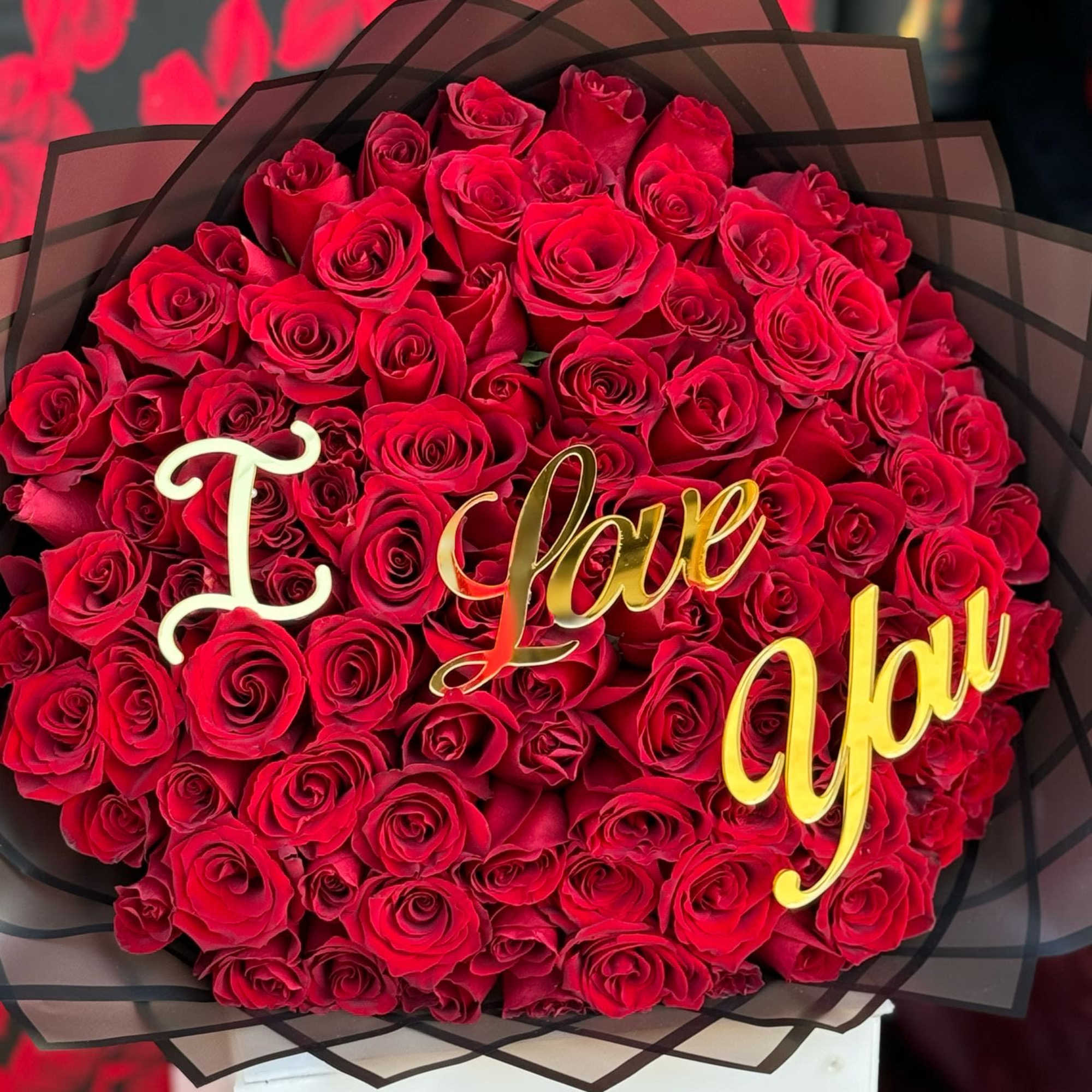 Express your deepest emotions with a breathtaking arrangement of 100 vibrant red