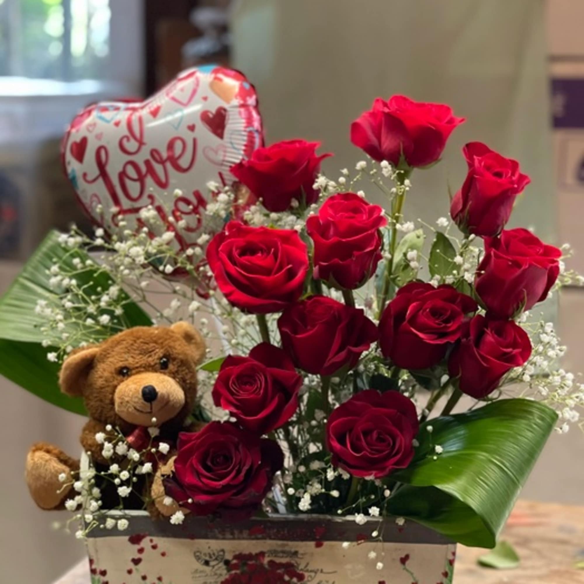Cute arrangement of roses, a teddy bear, and a valentines balloon all Cute arrangement of roses, a teddy bear, and a valentines balloon all