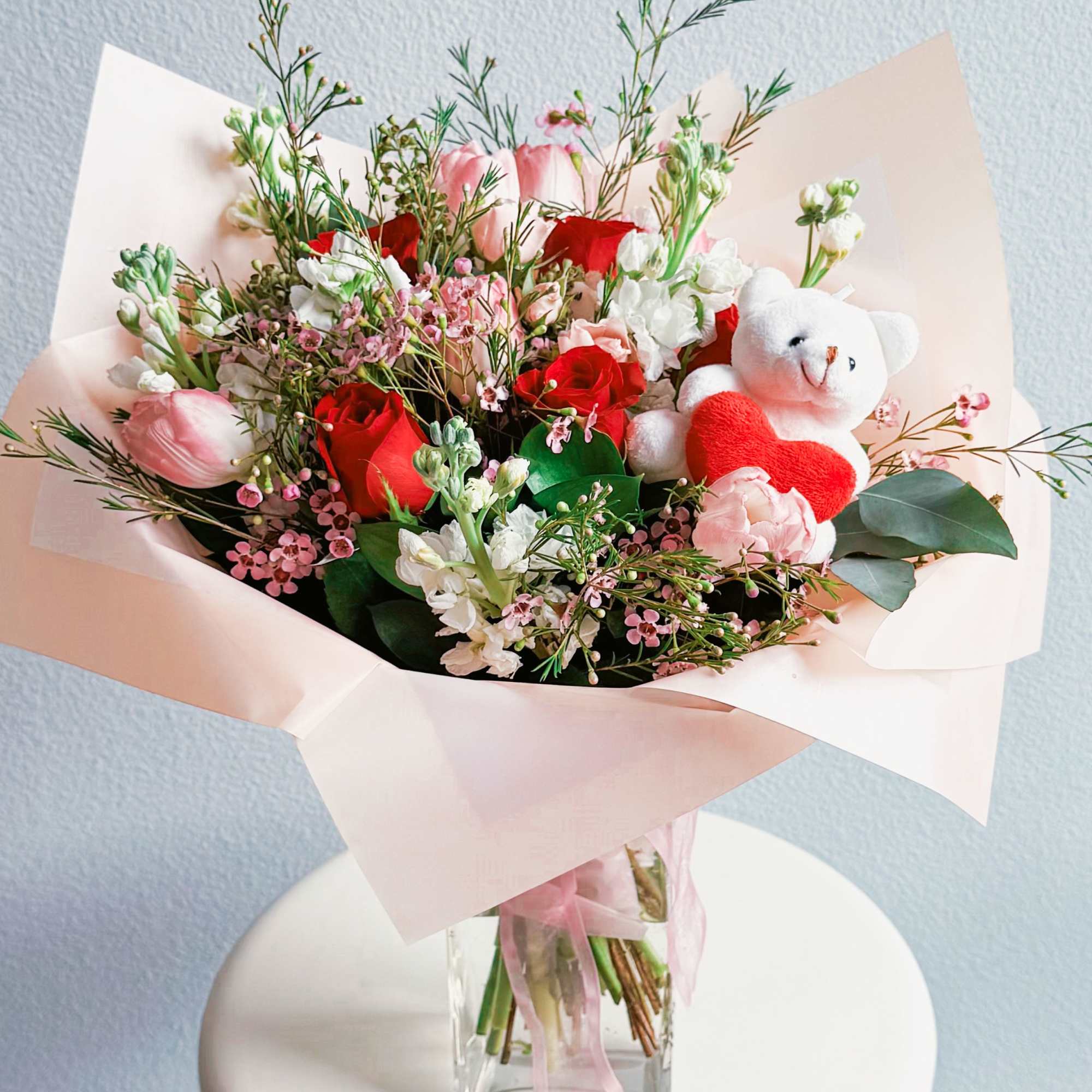 This bouquet is pure sweetness! A dreamy mix of red and blush This bouquet is pure sweetness! A dreamy mix of red and blush