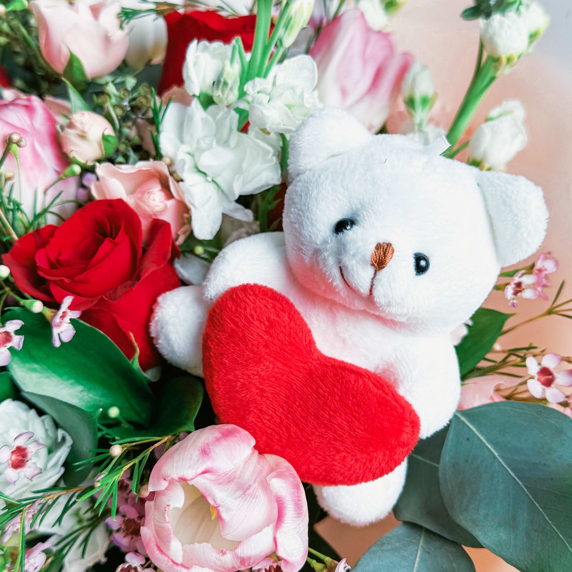 This bouquet is pure sweetness! A dreamy mix of red and blush This bouquet is pure sweetness! A dreamy mix of red and blush
