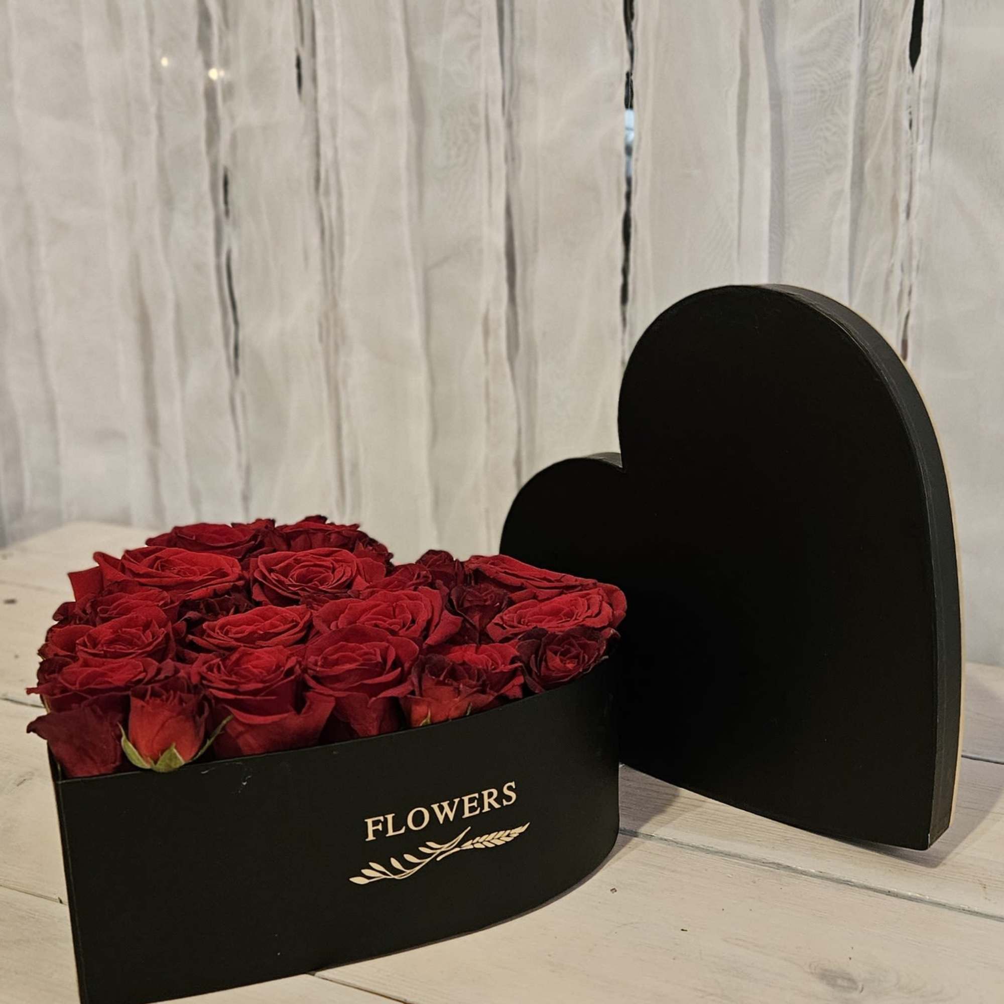 This heart shapped box is filled with 28-30 roses, and 15 spray This heart shapped box is filled with 28-30 roses, and 15 spray