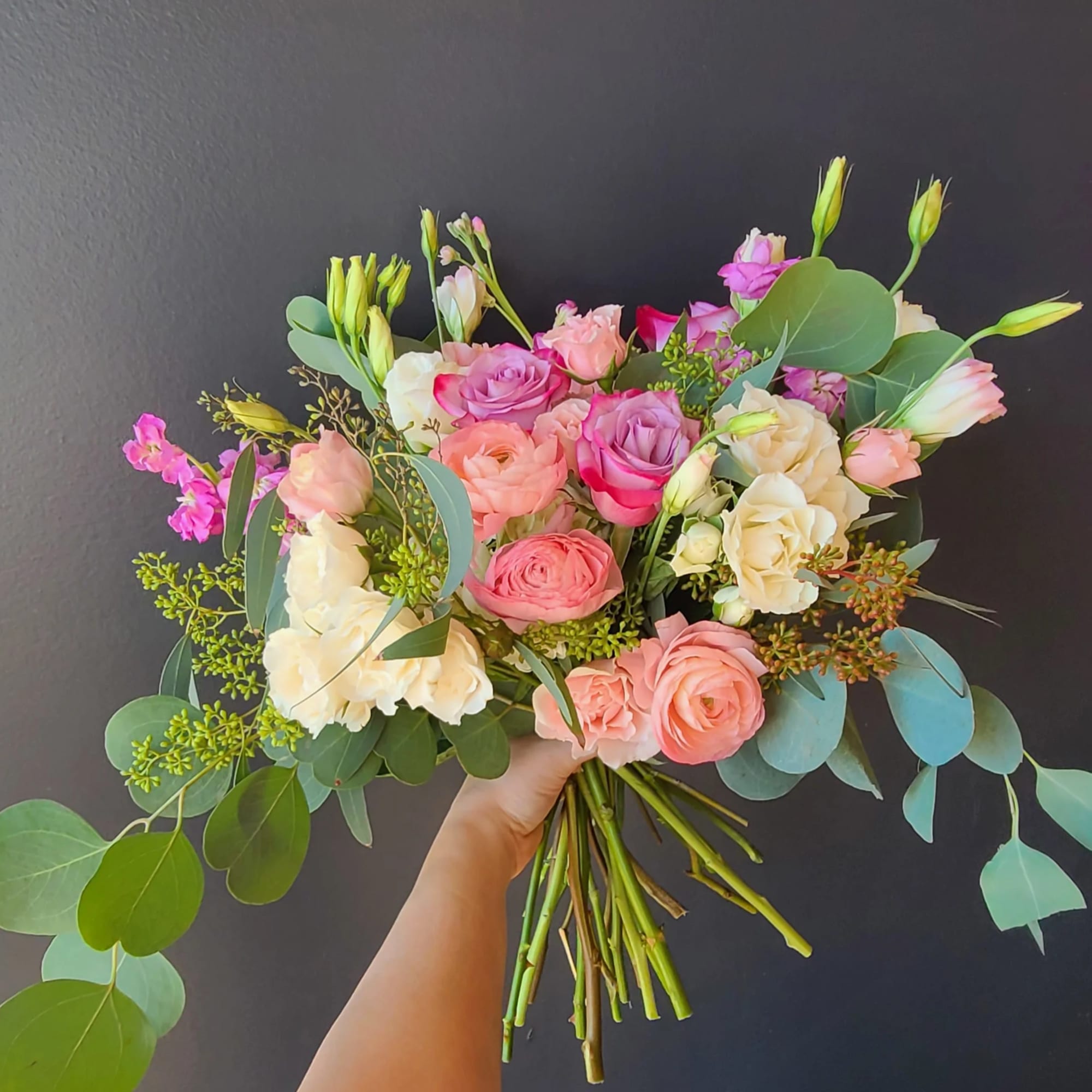 Cool off with this lovely bouquet of roses and hydrangeas. Handtied bouquet