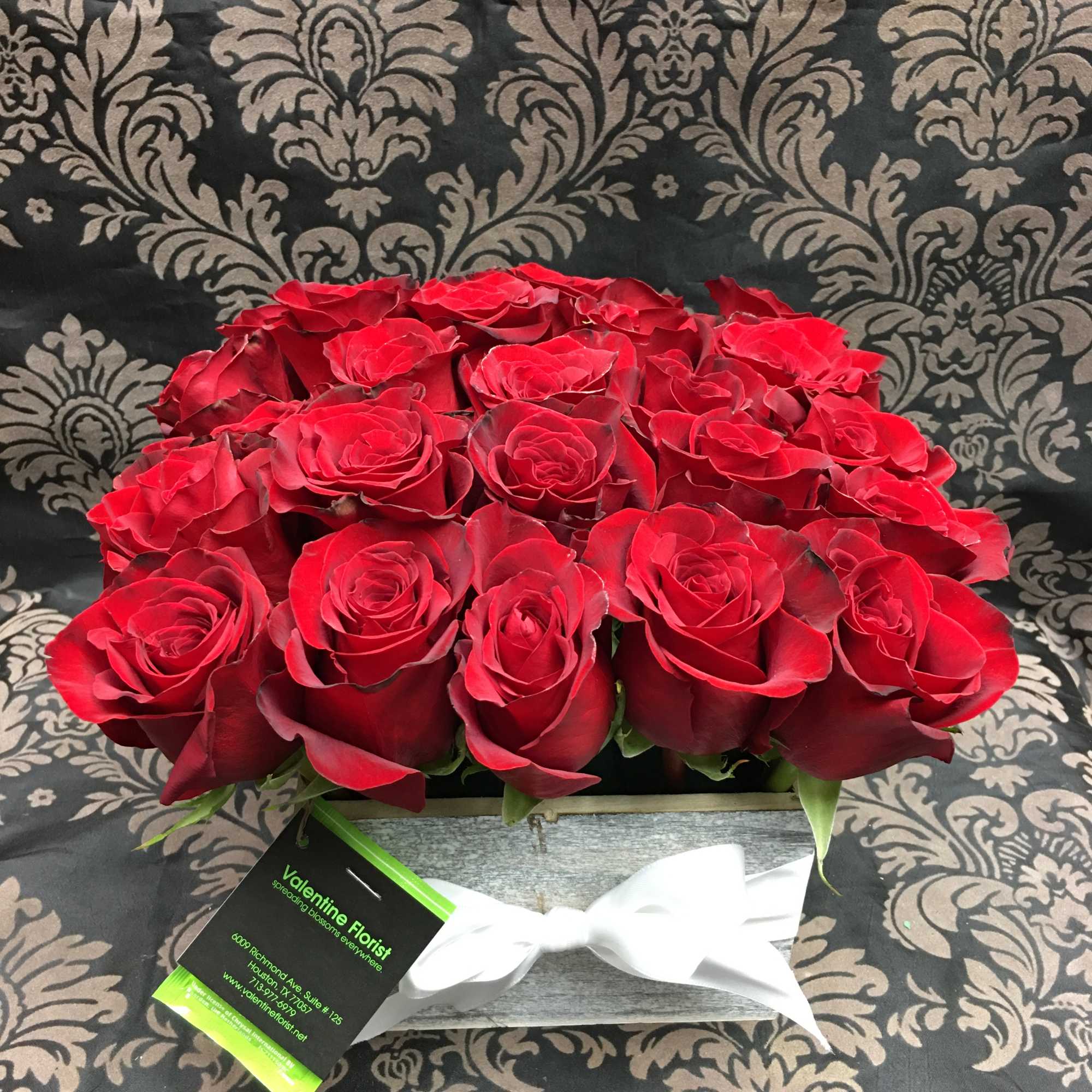 This eye-catching arrangement offers a modern twist on the classic dozen. Rustic