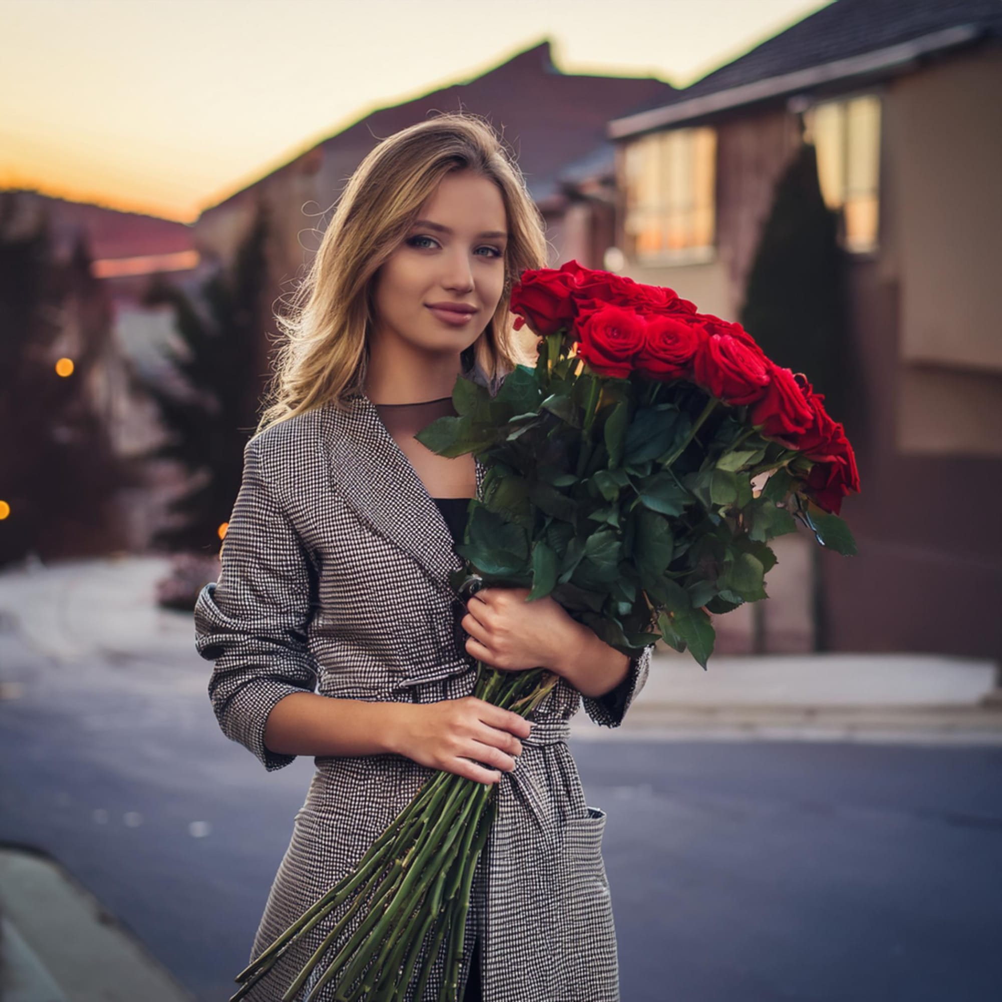 50 extra long stemmed red roses traditionally handtied with a red ribbon.
