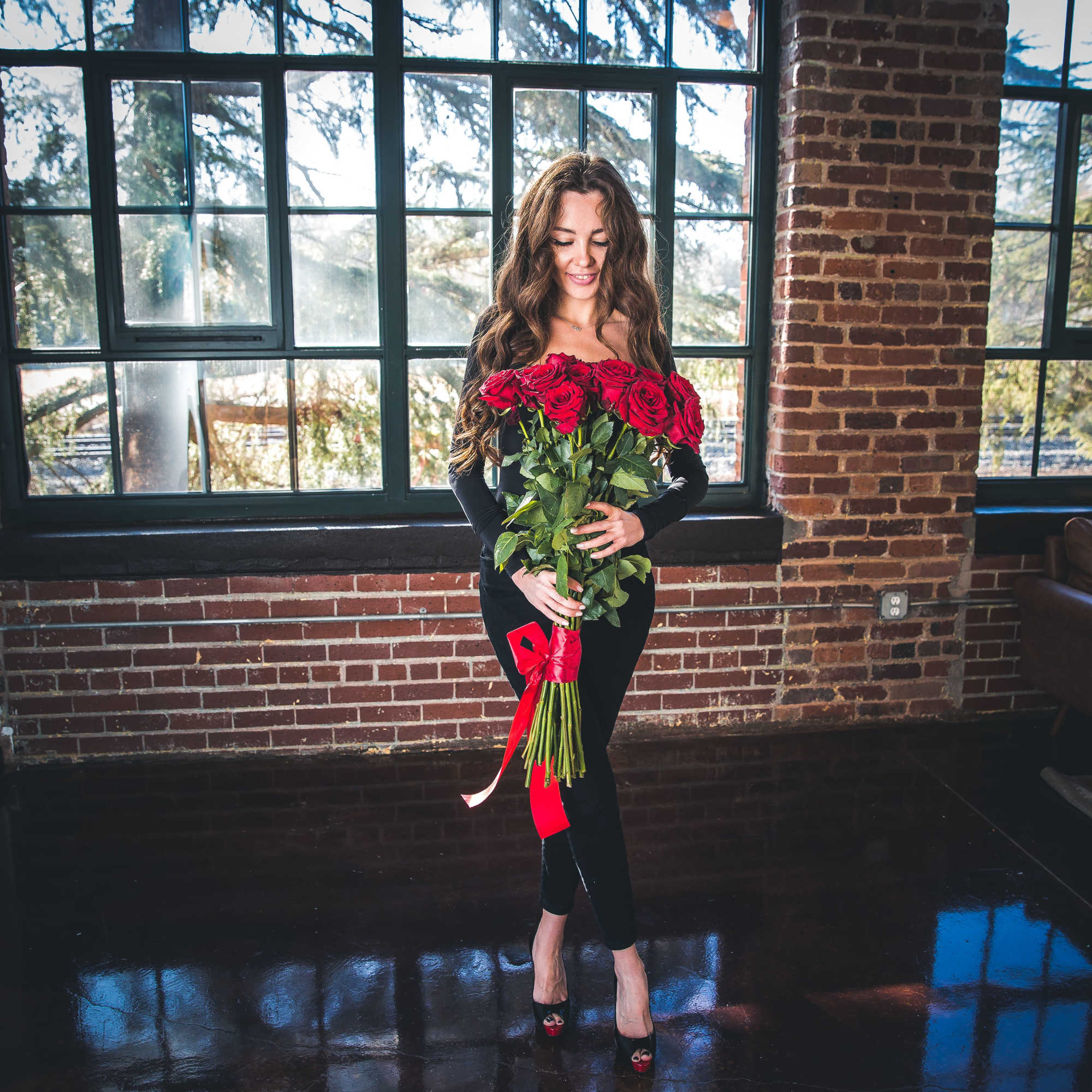 50 extra long stemmed red roses traditionally handtied with a red ribbon.