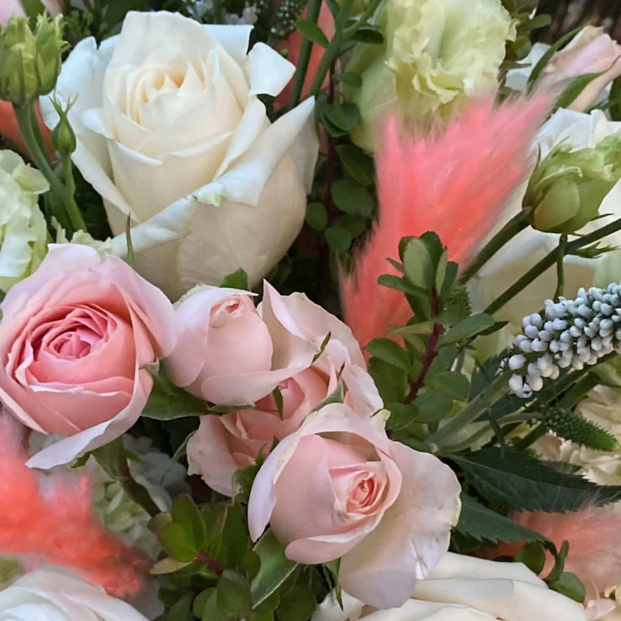 Beautiful variety of premium blush florals in a birch box accented with