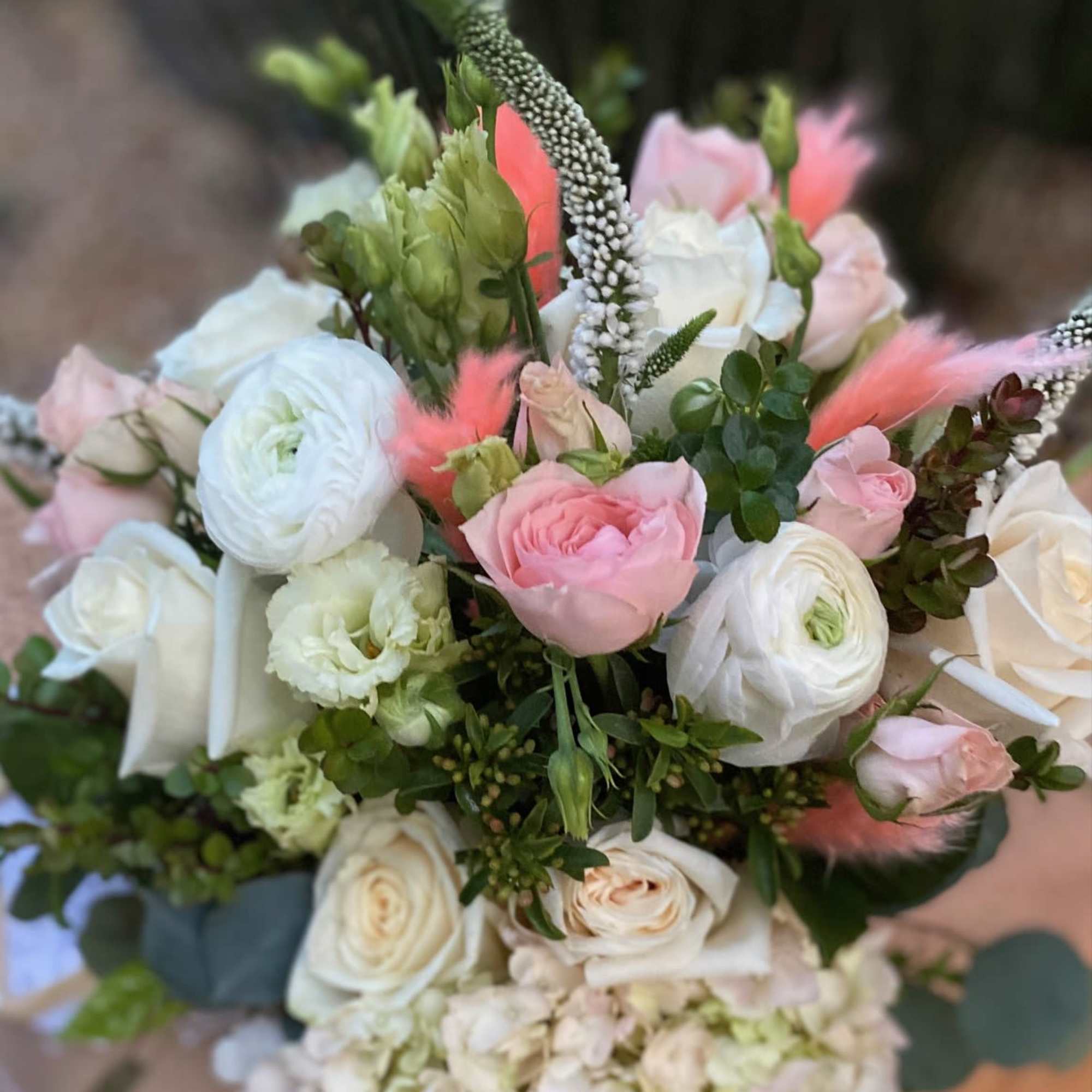 Beautiful variety of premium blush florals in a birch box accented with
