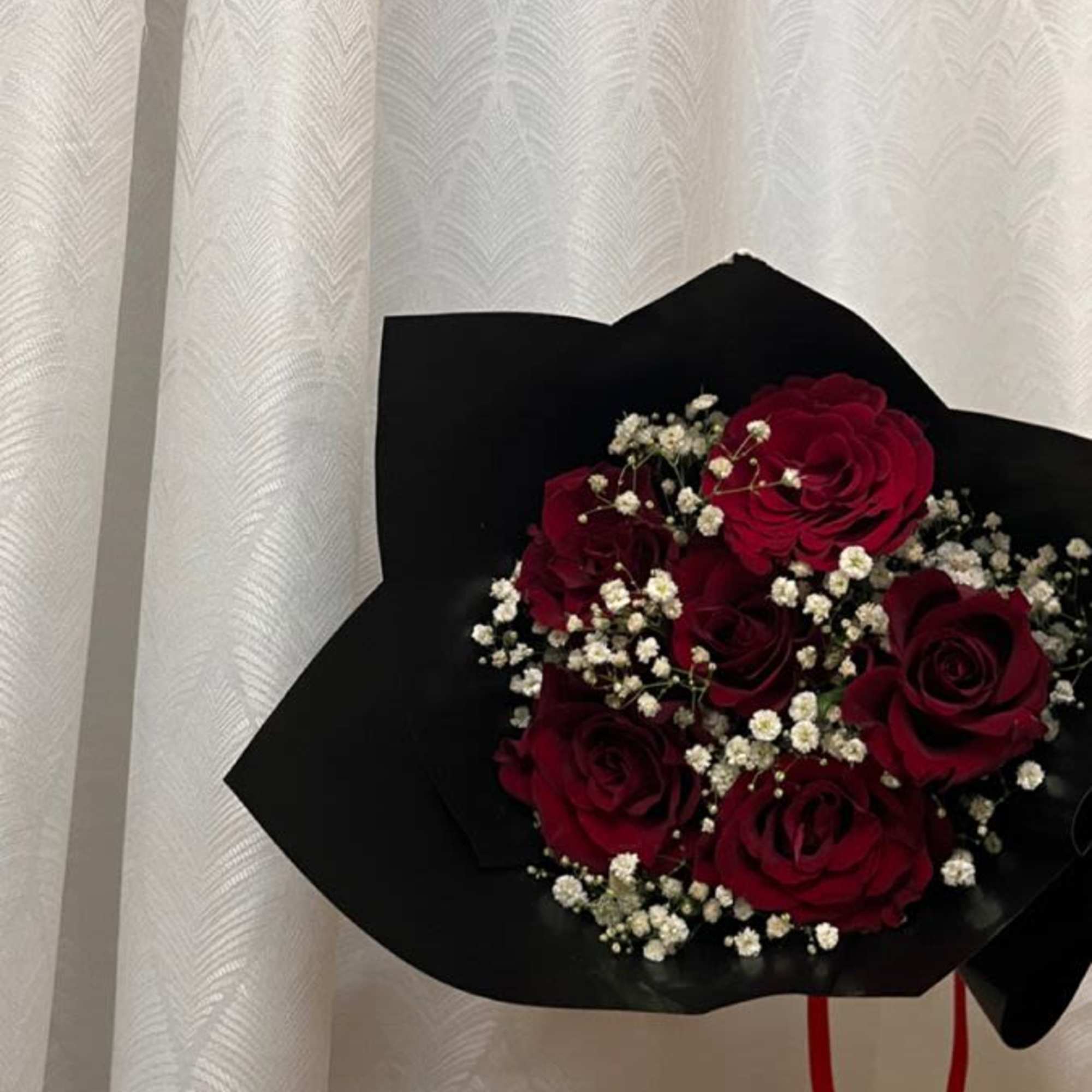 12  RED roses beautifully hand tied with floral paper and ready 12  RED roses beautifully hand tied with floral paper and ready