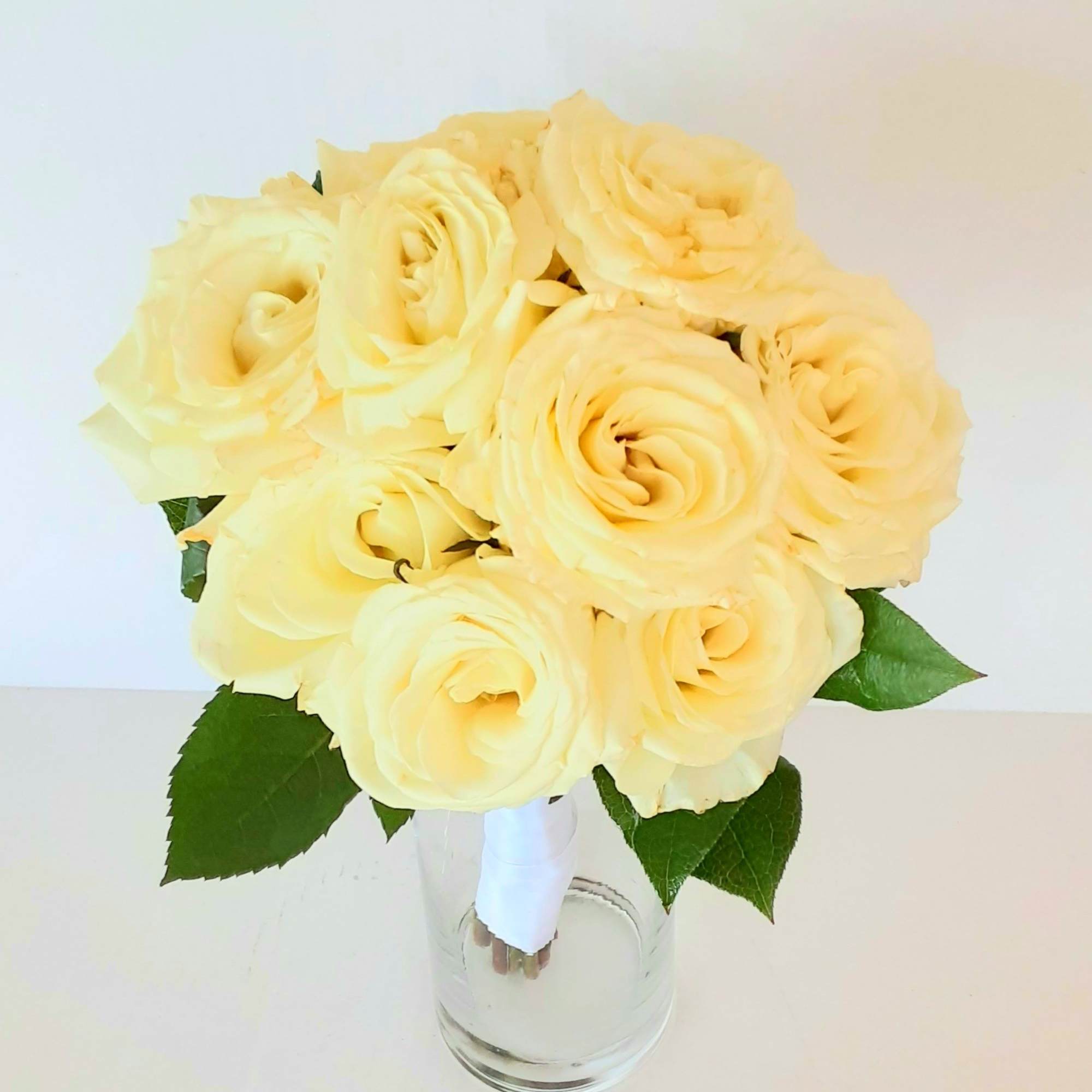 A classic rose and baby&#039;s breath bouquet hand tied with ribbon. The