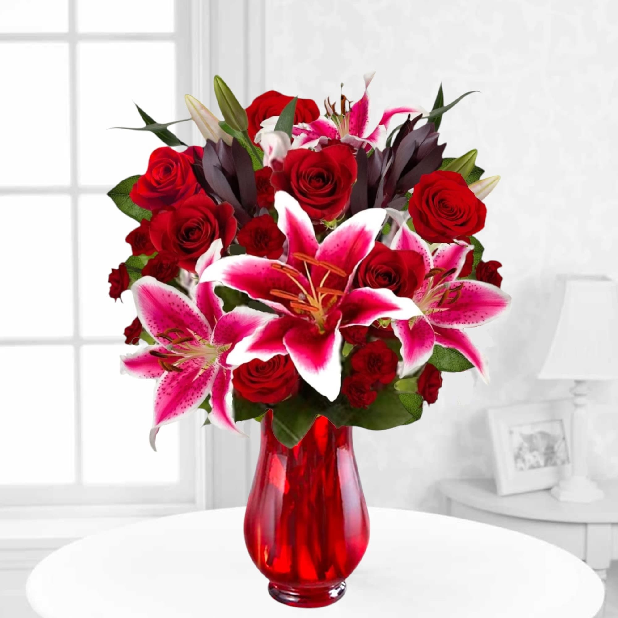 Cupid&#039;s Floral Arrangement blossoms with roses and Stargazer lilies to display your