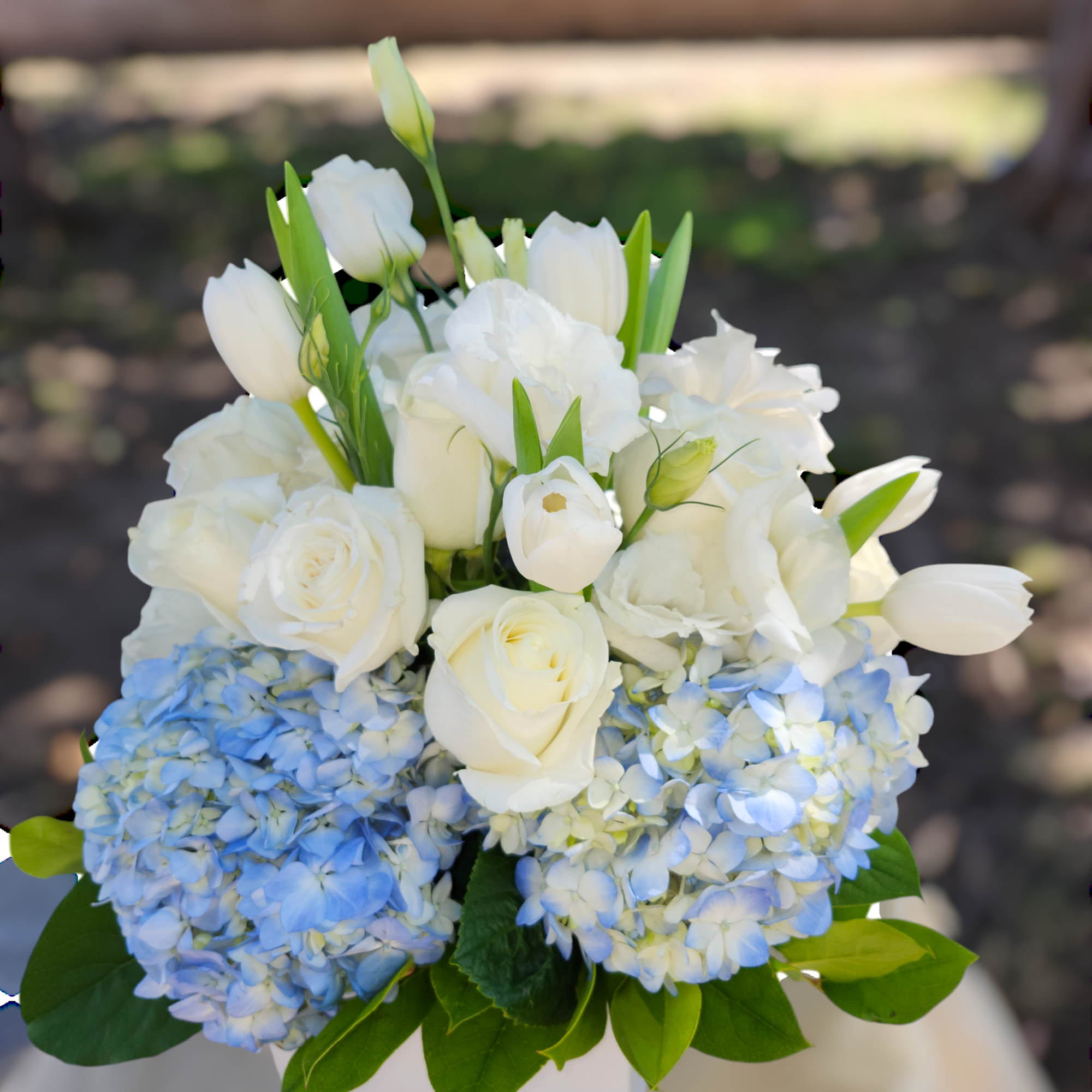 Send something to let them know you care. Featuring blue hydrangea, white