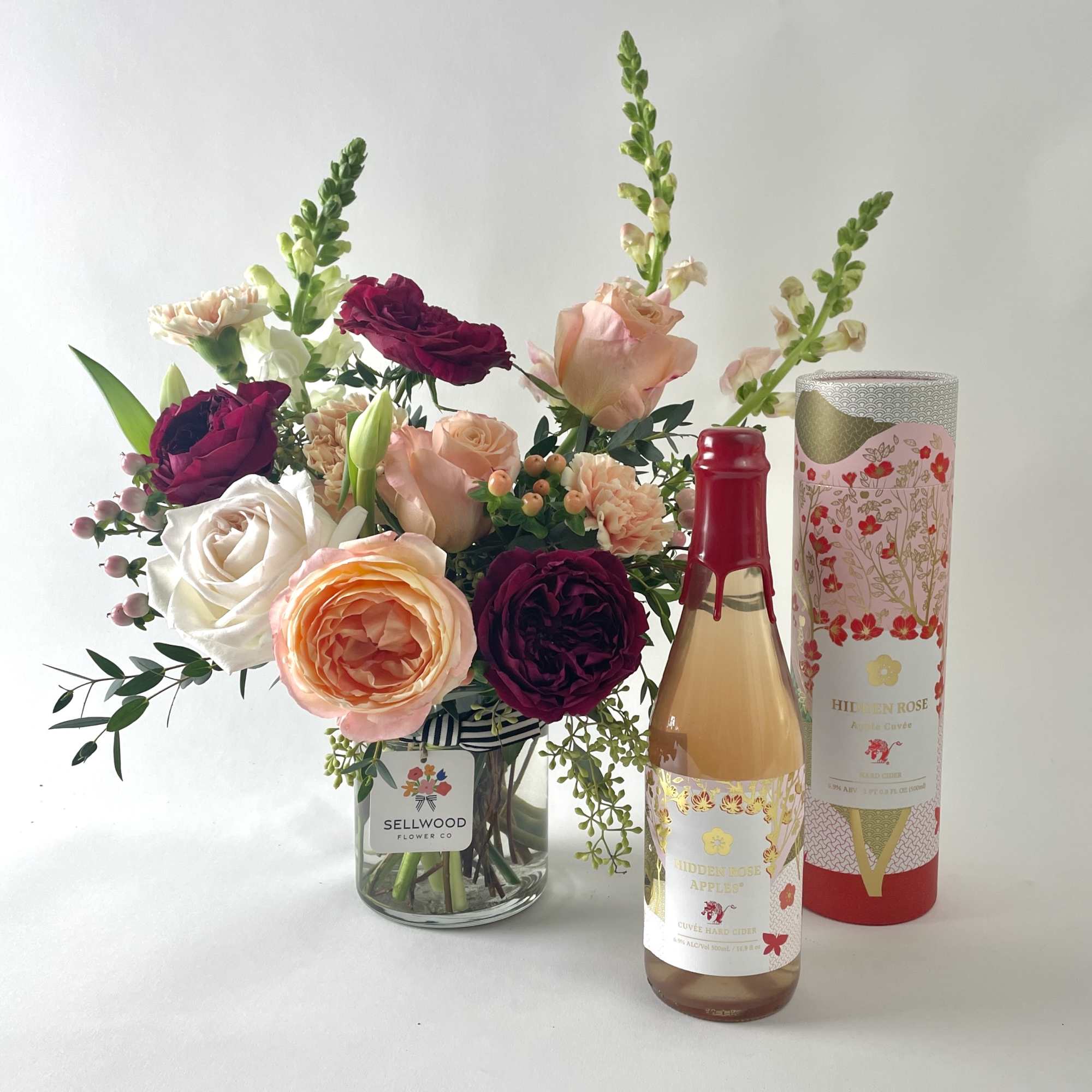 Whimsical and joyful gift set that includes a garden-style floral arrangement and