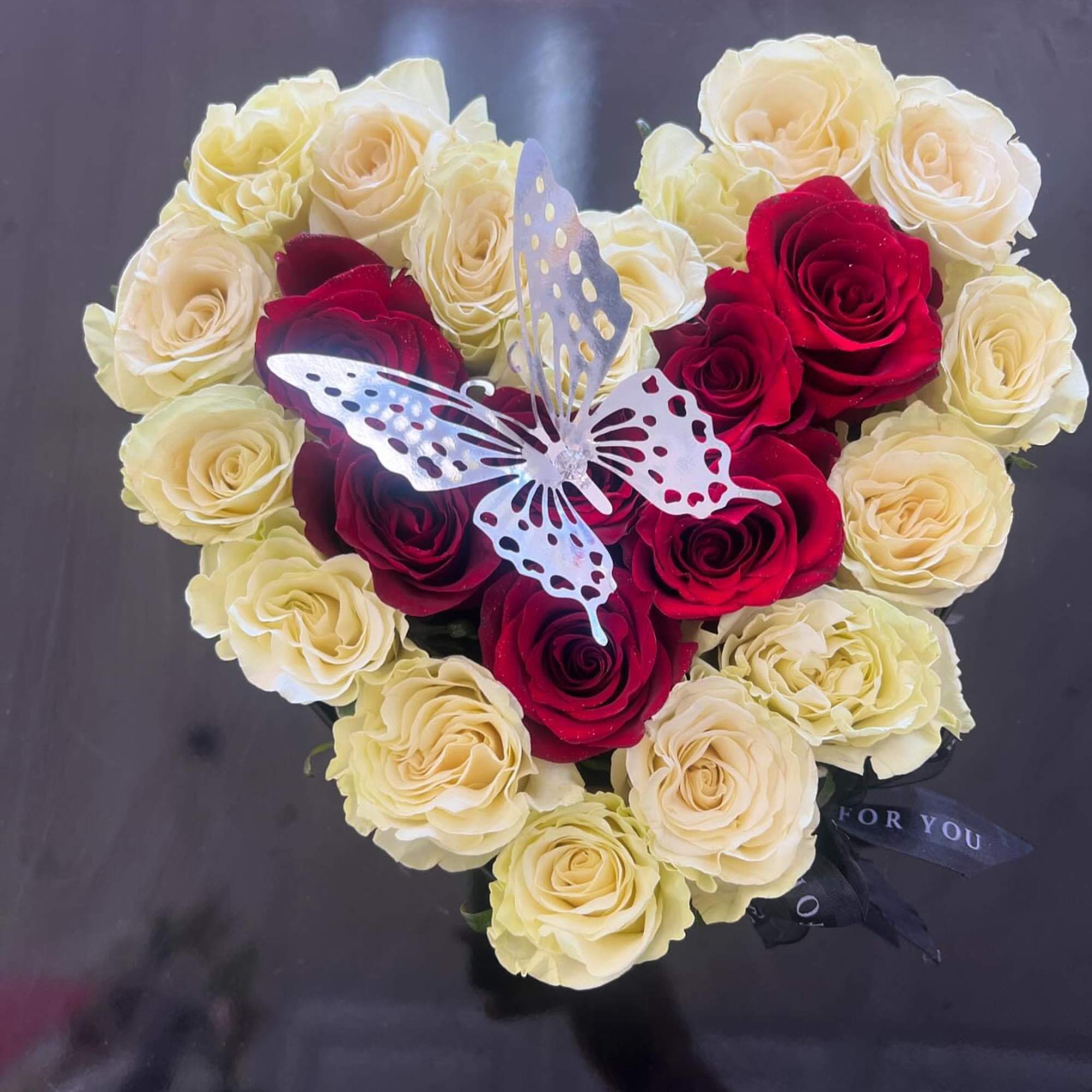 Each bloom is artfully arranged to create a lush, eye-catching presentation that