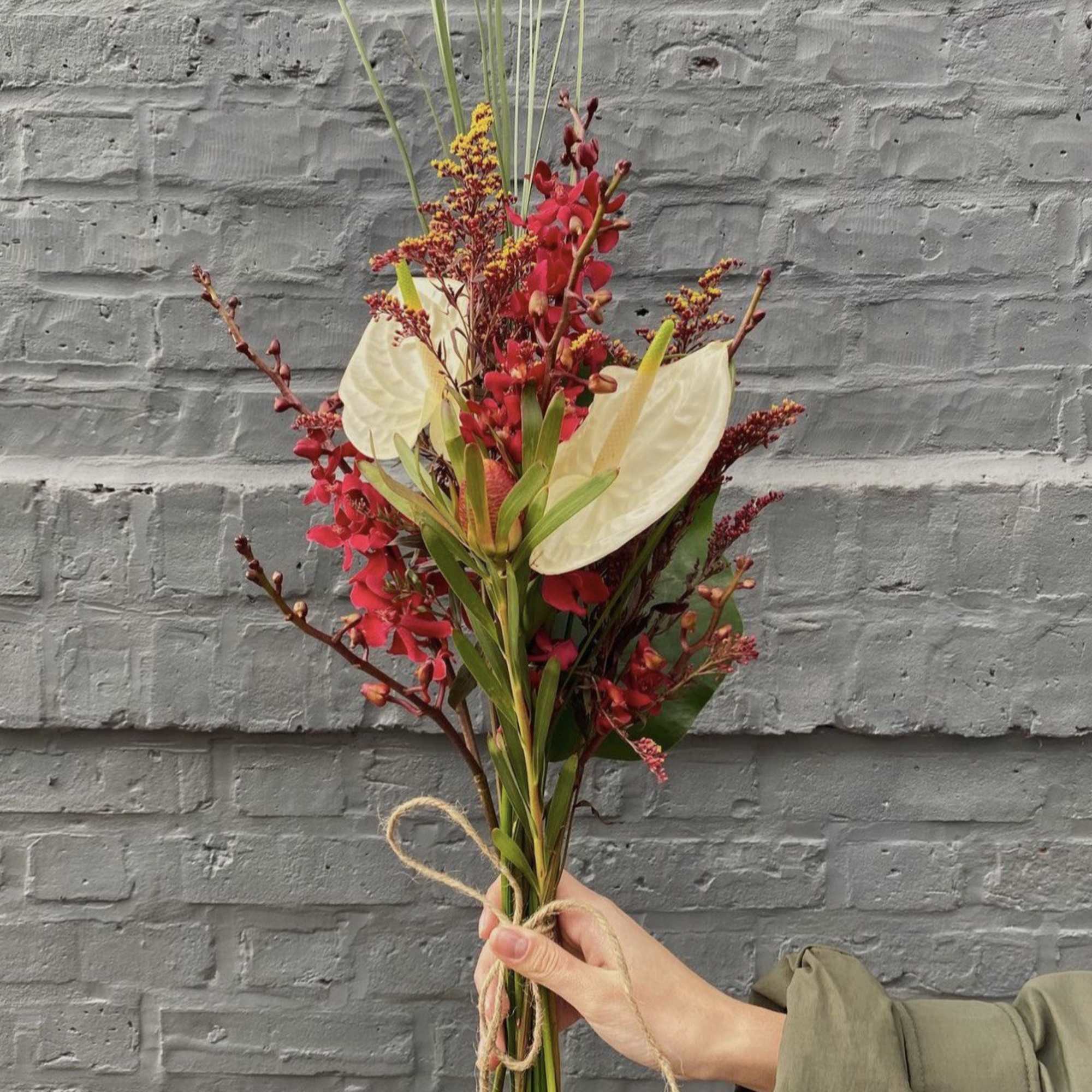 Red mix flowers with mini orchids 