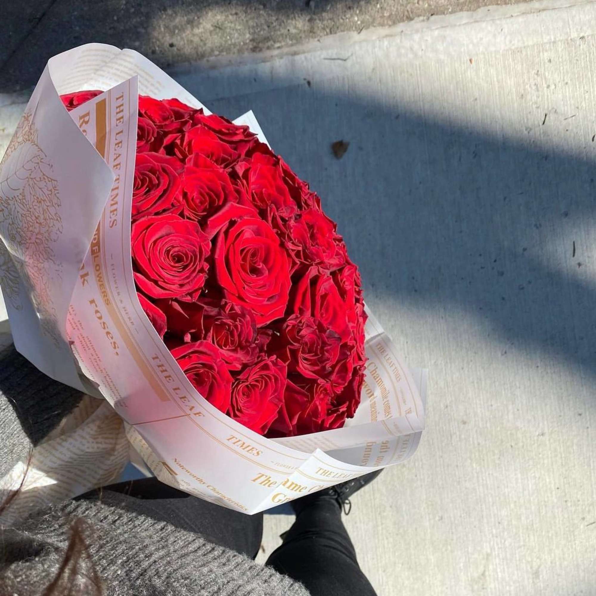red roses with magazine white wrap