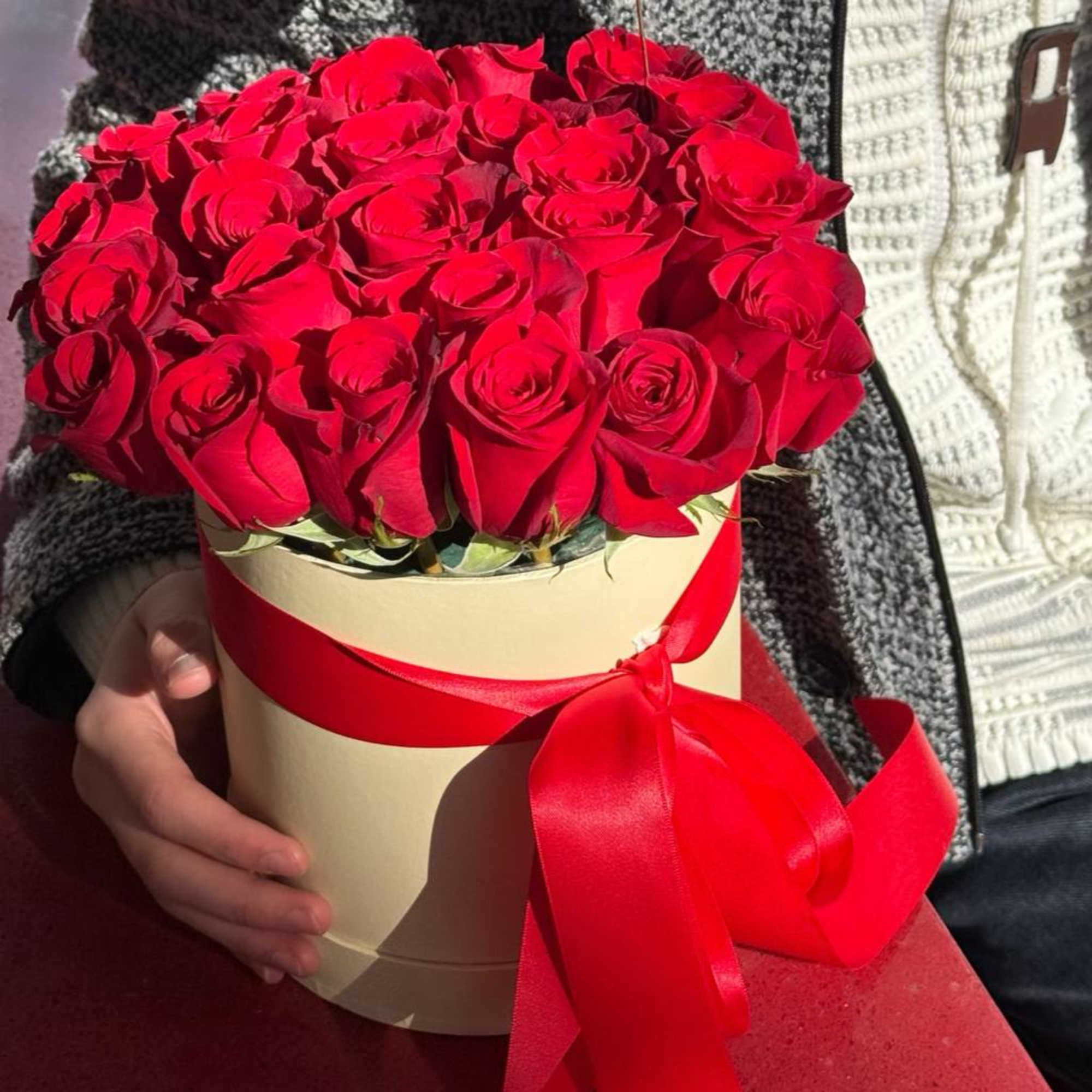 A luxurious box of scarlet roses&mdash;an embodiment of passion and elegance. The