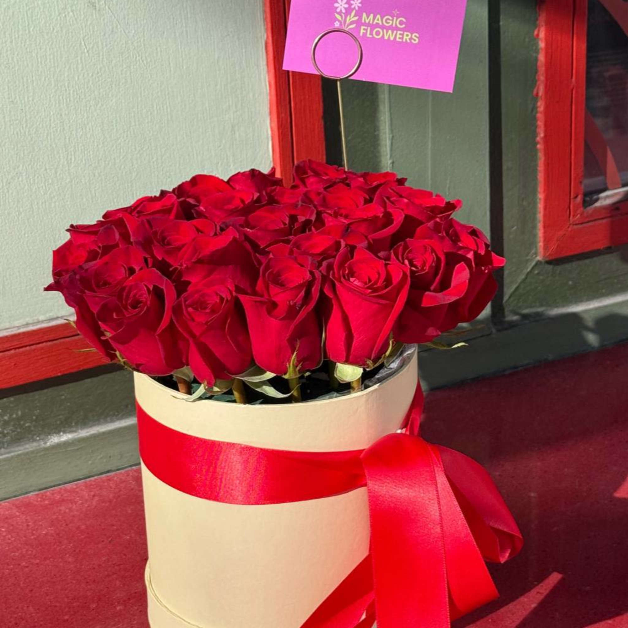 A luxurious box of scarlet roses&mdash;an embodiment of passion and elegance. The