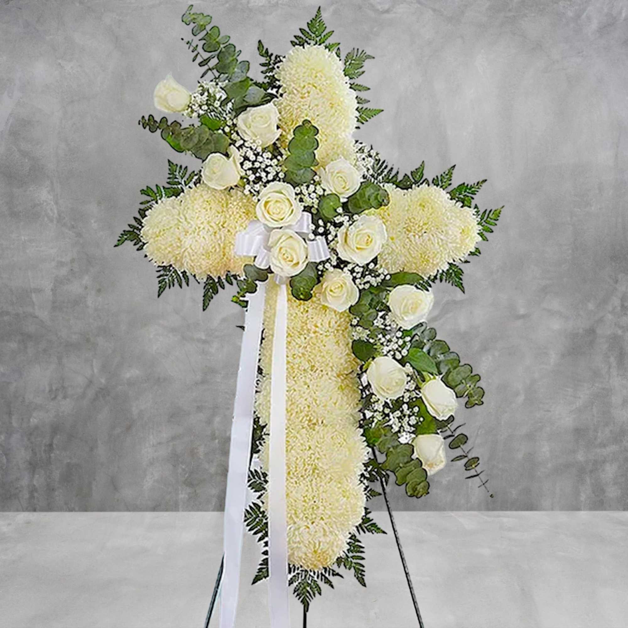 Honor a lifetime of faithful devotion with our beautiful standing cross arrangement.