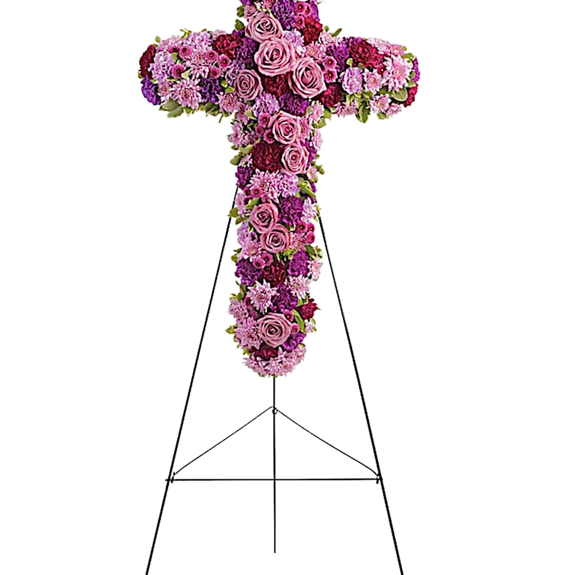 A breathtaking standing cross of majestic purple and lavender blooms remembers and