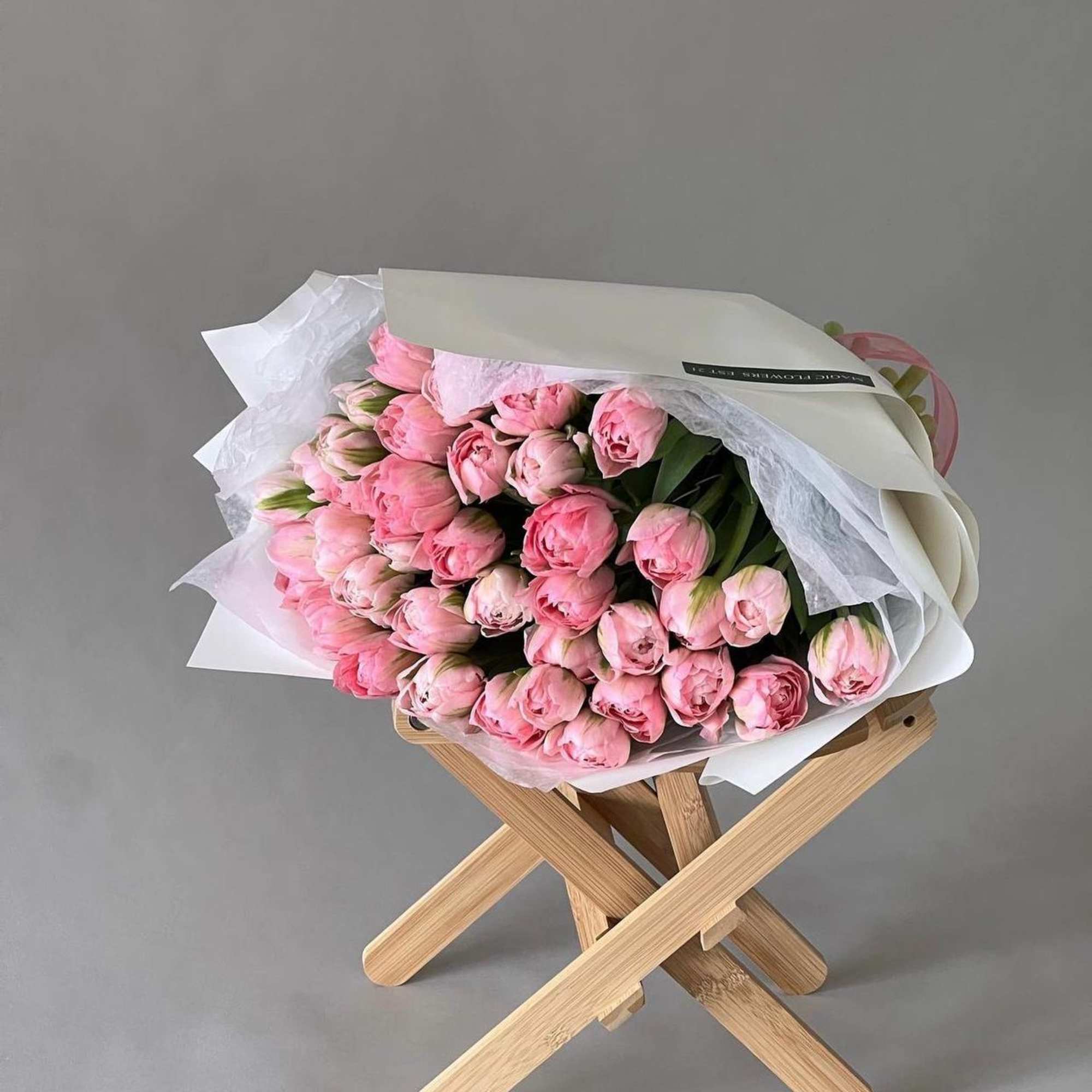 A monobucket of pink tulips is a sophisticated and elegant composition filled