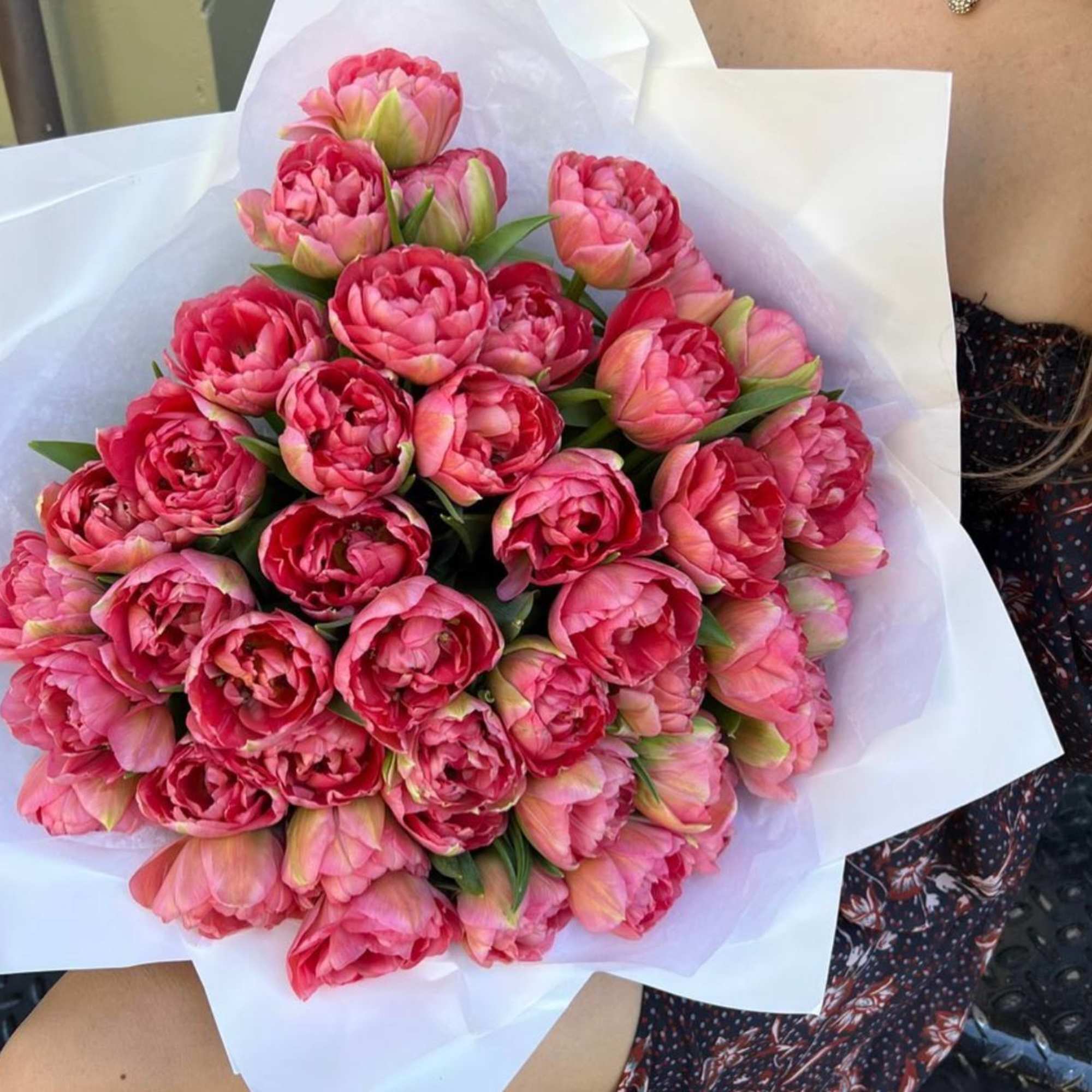 A bouquet of bright pink tulips is a lively and energetic composition