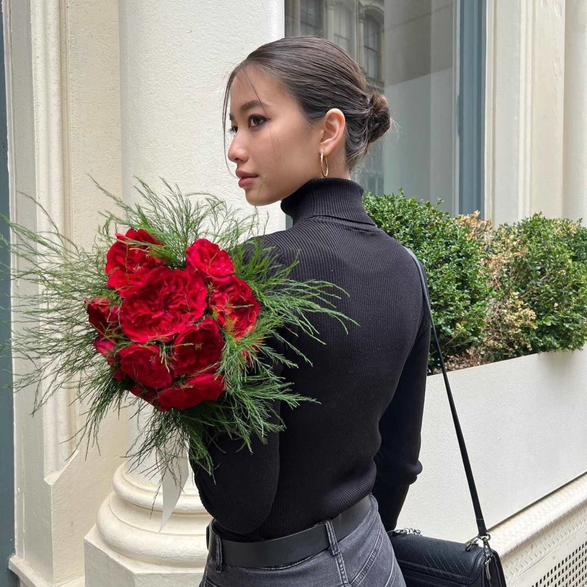 A bouquet of premium red garden roses with greenery is an elegant