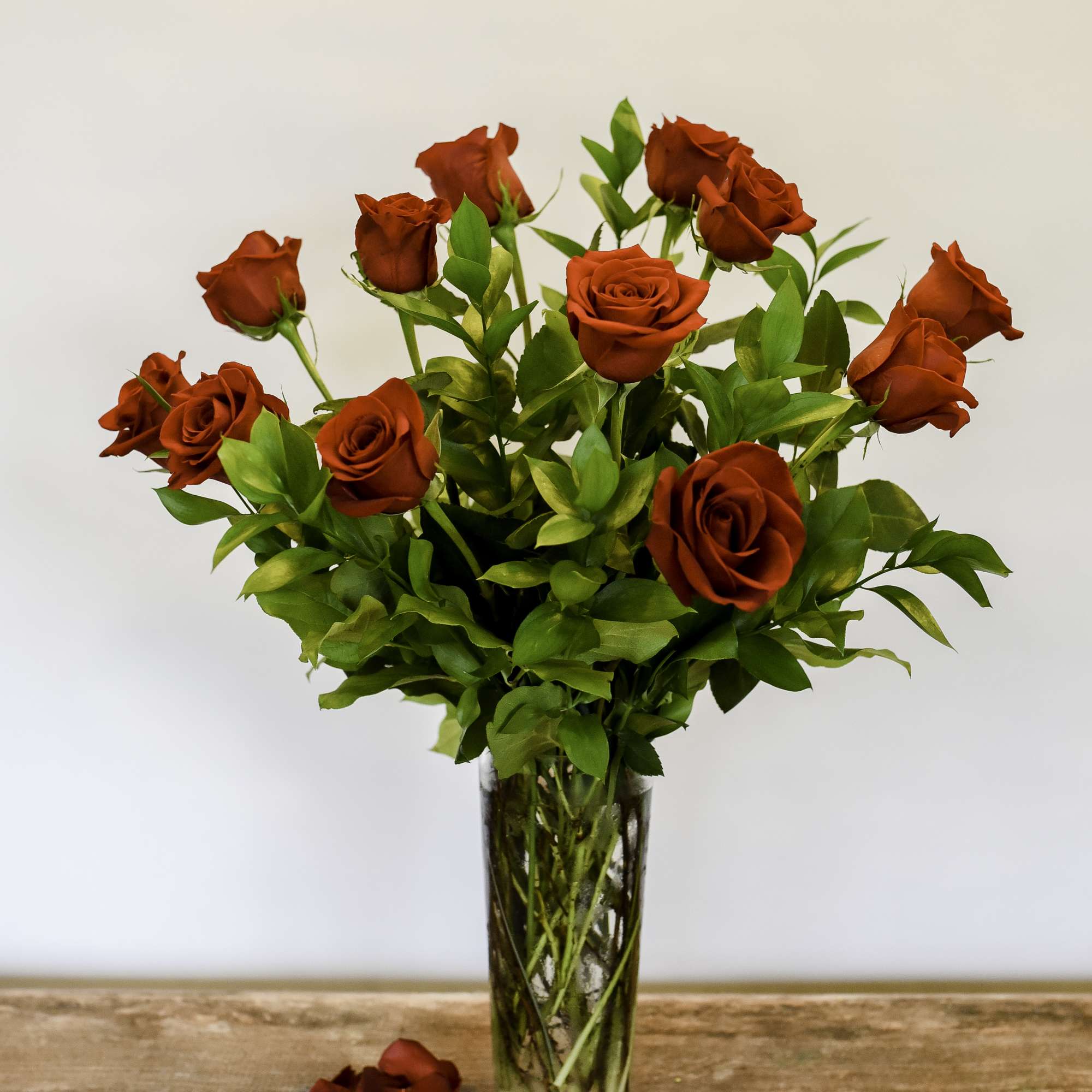 One dozen premium, long stem roses traditionally arranged remain a classic. 
You