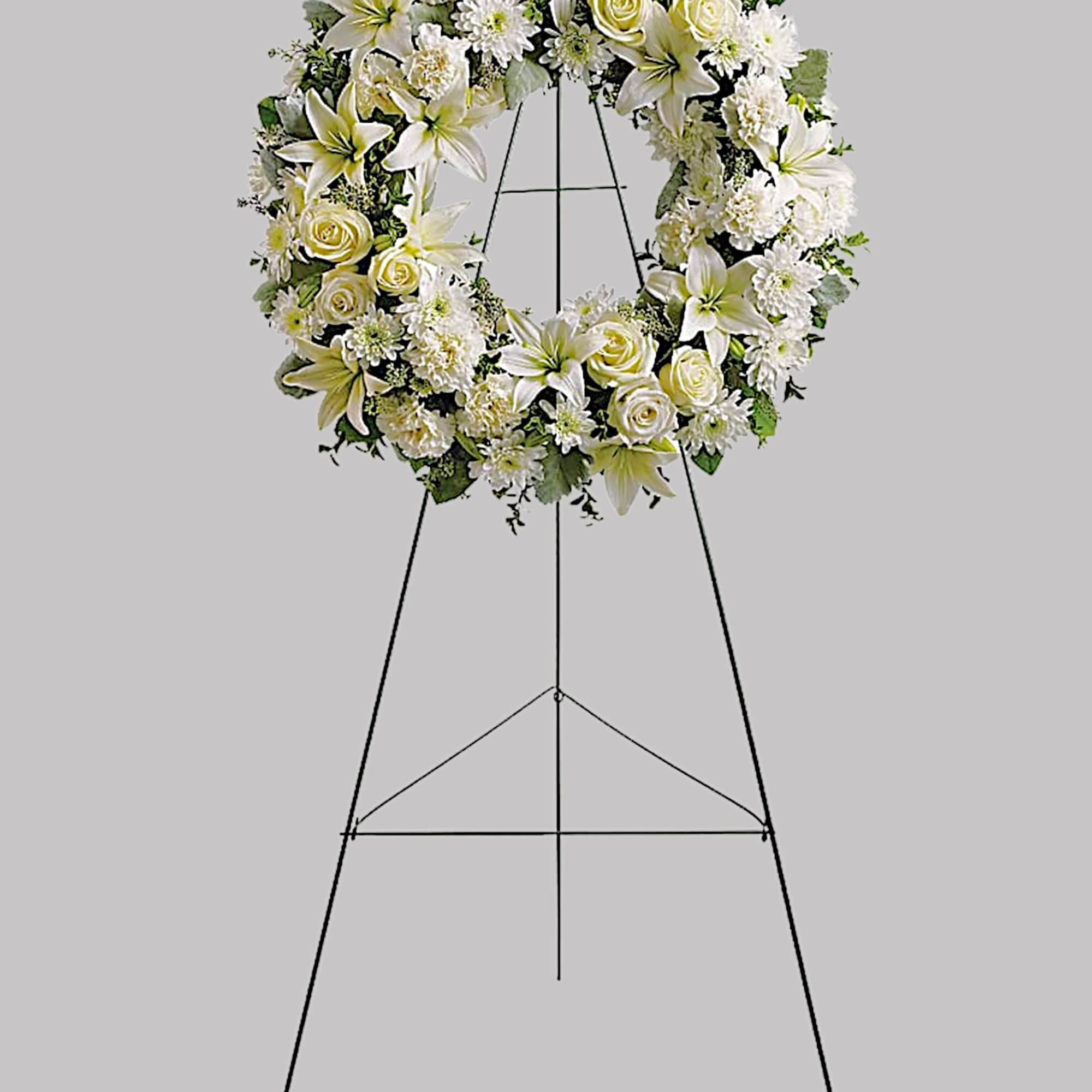 Fragrant white blossoms set among a ring of soothing greens form a