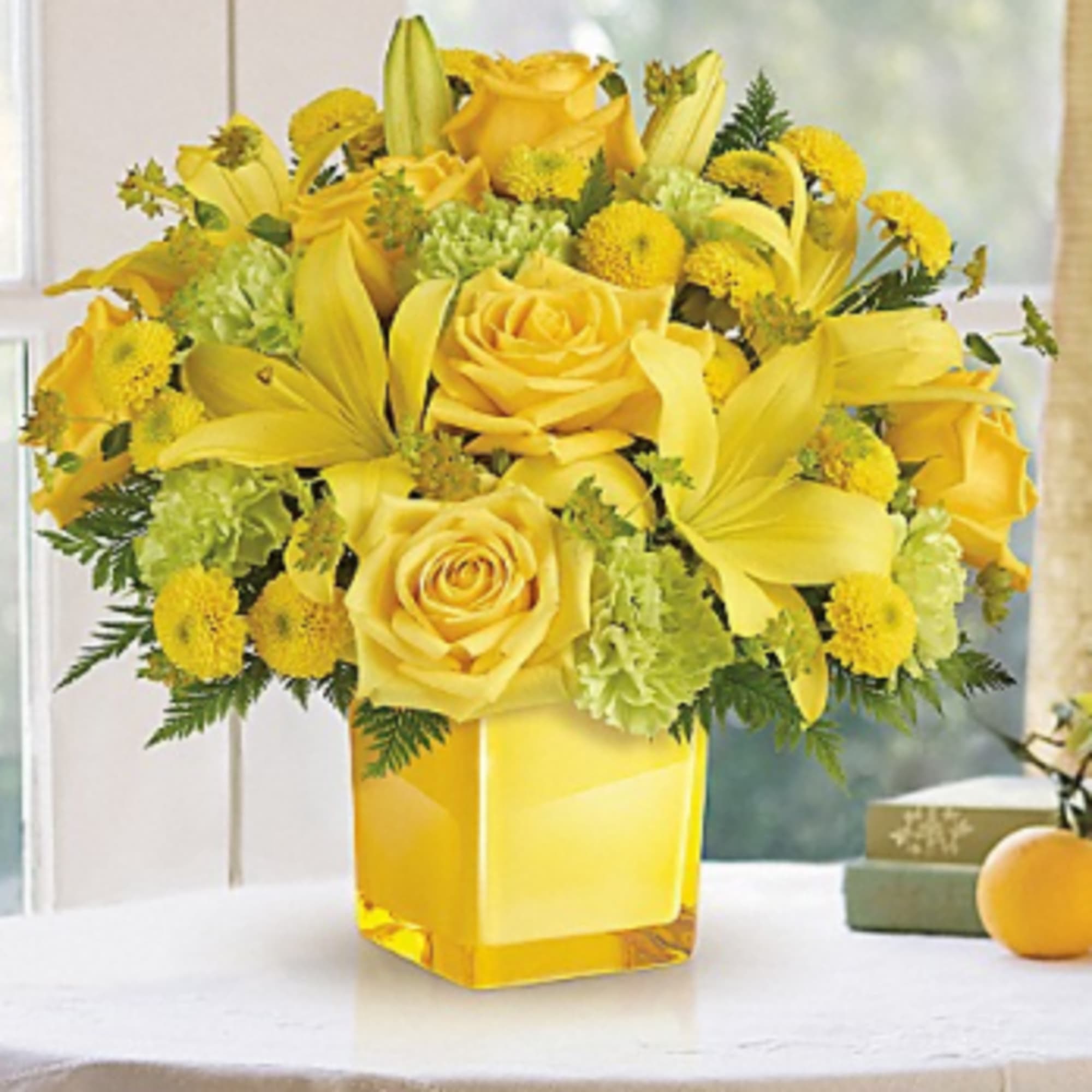 This bright bouquet includes yellow roses, yellow asiatic lilies, green carnations, yellow
