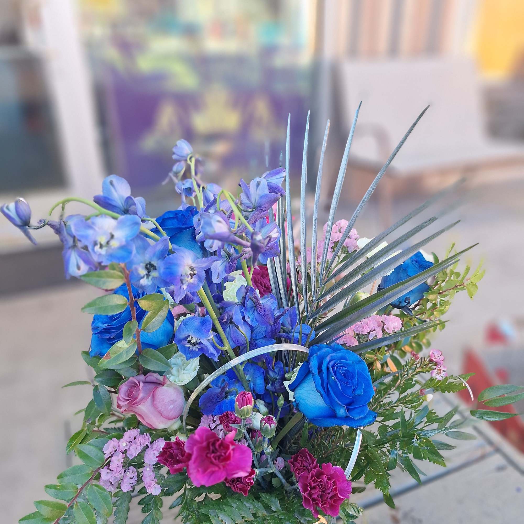 A blend of Blue, Lavender and Fuschia with green filler and greenery A blend of Blue, Lavender and Fuschia with green filler and greenery