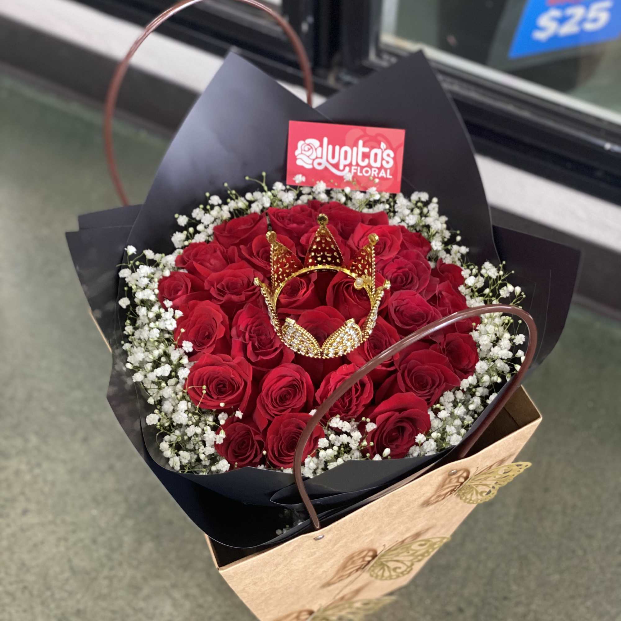 This small buch&oacute;n consists of 24 Roses, babies breath, and a small