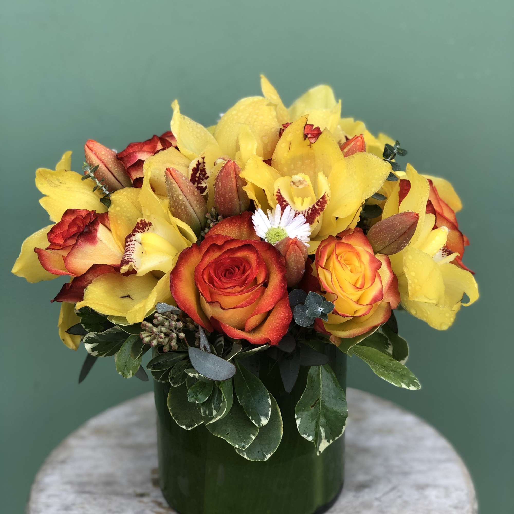 Cute and unique vase complemented with Roses, Tulips, Orchids, and Greens.
Note: The Cute and unique vase complemented with Roses, Tulips, Orchids, and Greens.
Note: The
