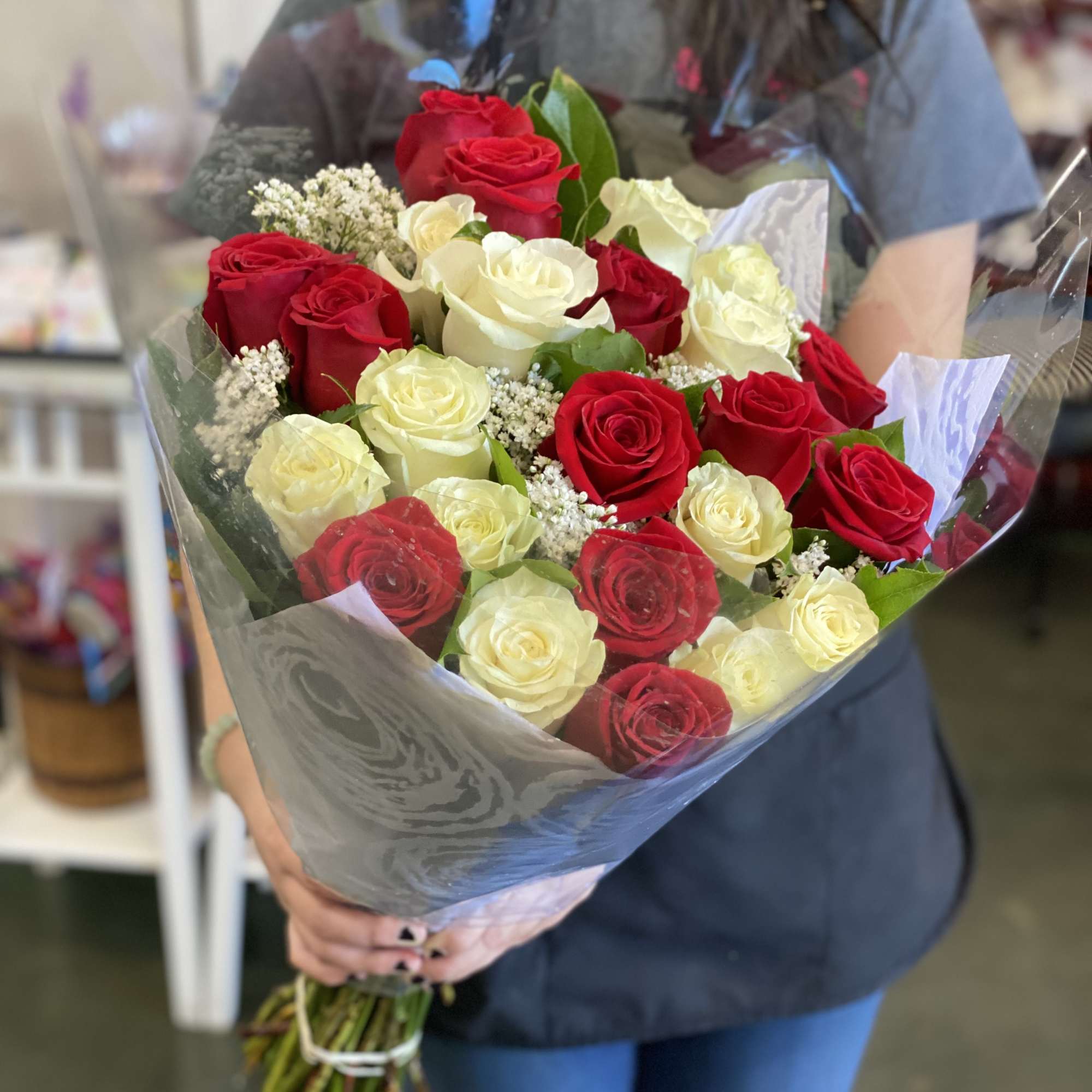 Wrapped in cellophane/plastic paper and a simple colored Polyester paper. These are