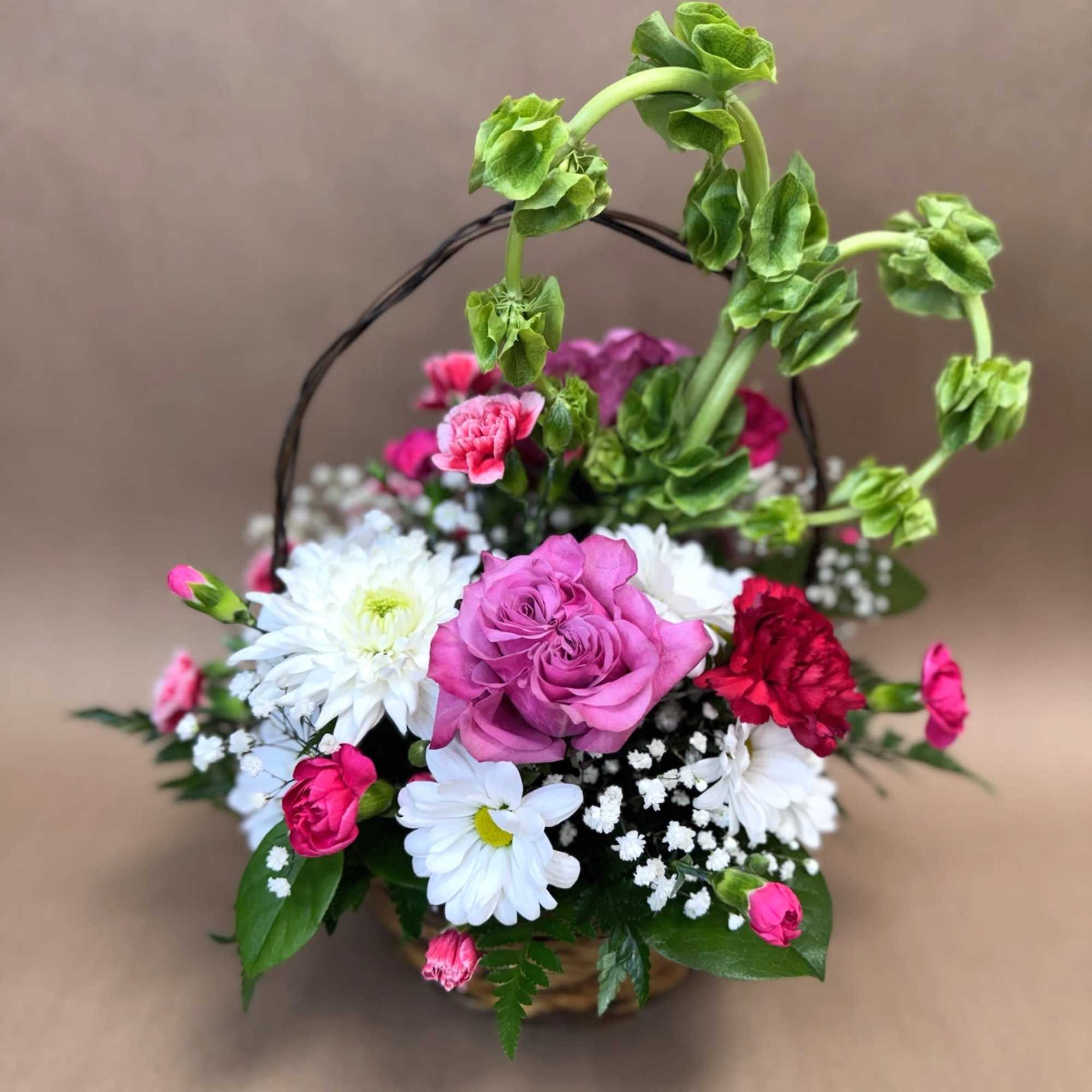 Love Machine is a stunning floral basket overflowing with romance and charm. Love Machine is a stunning floral basket overflowing with romance and charm.