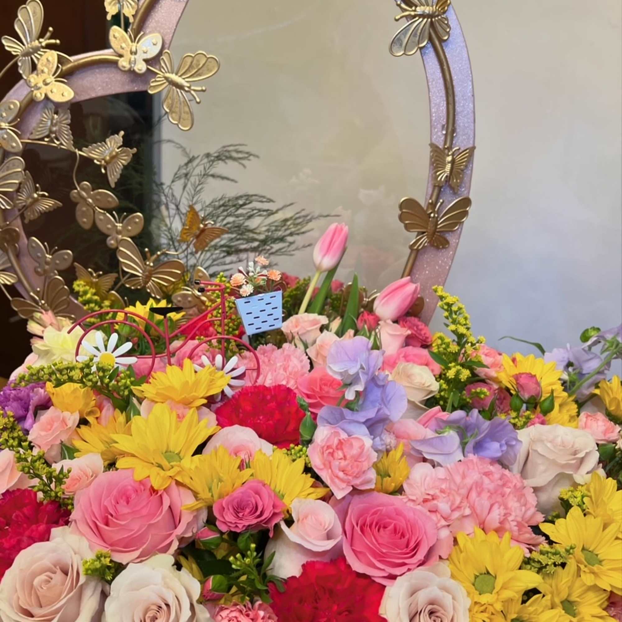 Large heart box with metal butterfly frame. 
Spring flowers: roses, carnation, alstromerias