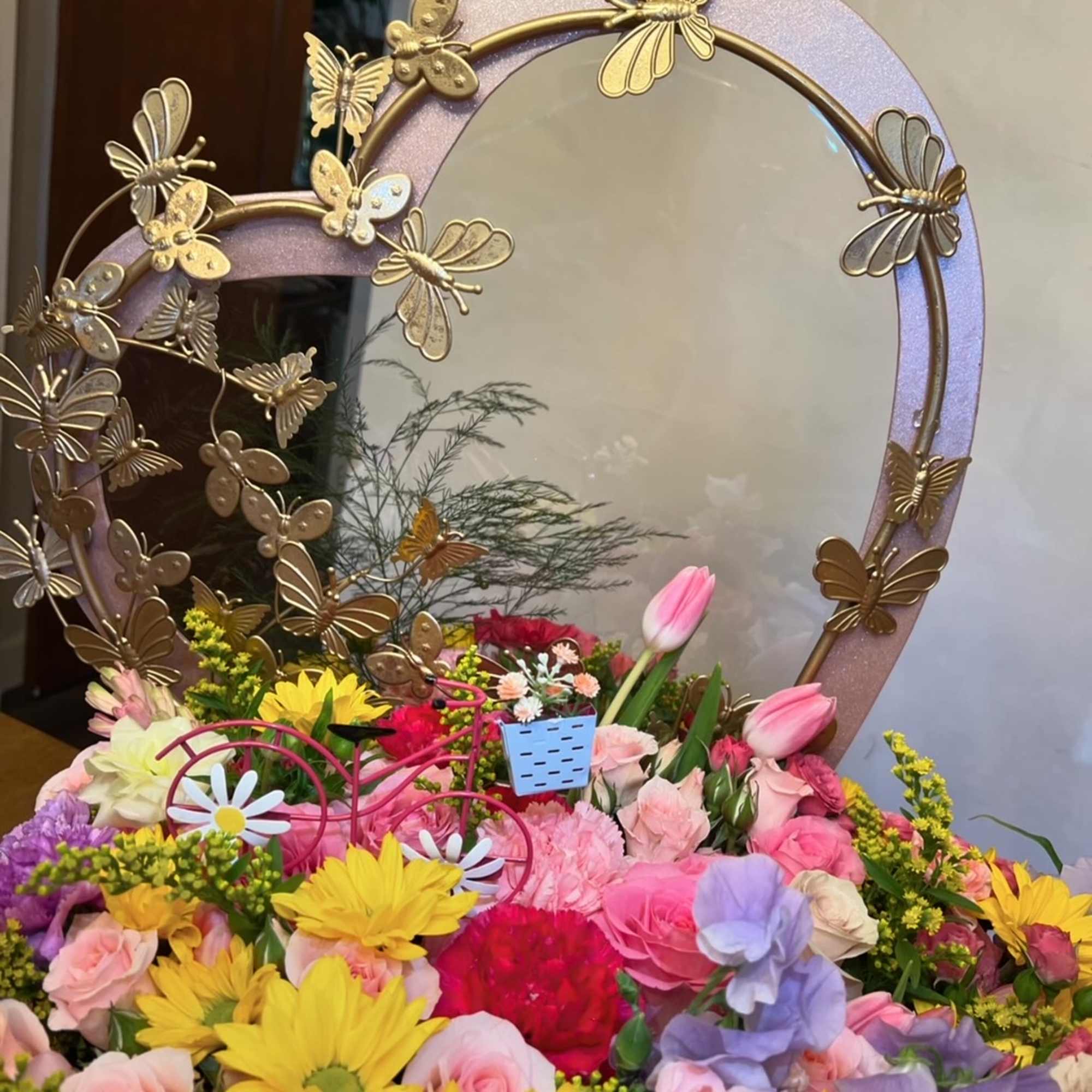 Large heart box with metal butterfly frame. 
Spring flowers: roses, carnation, alstromerias